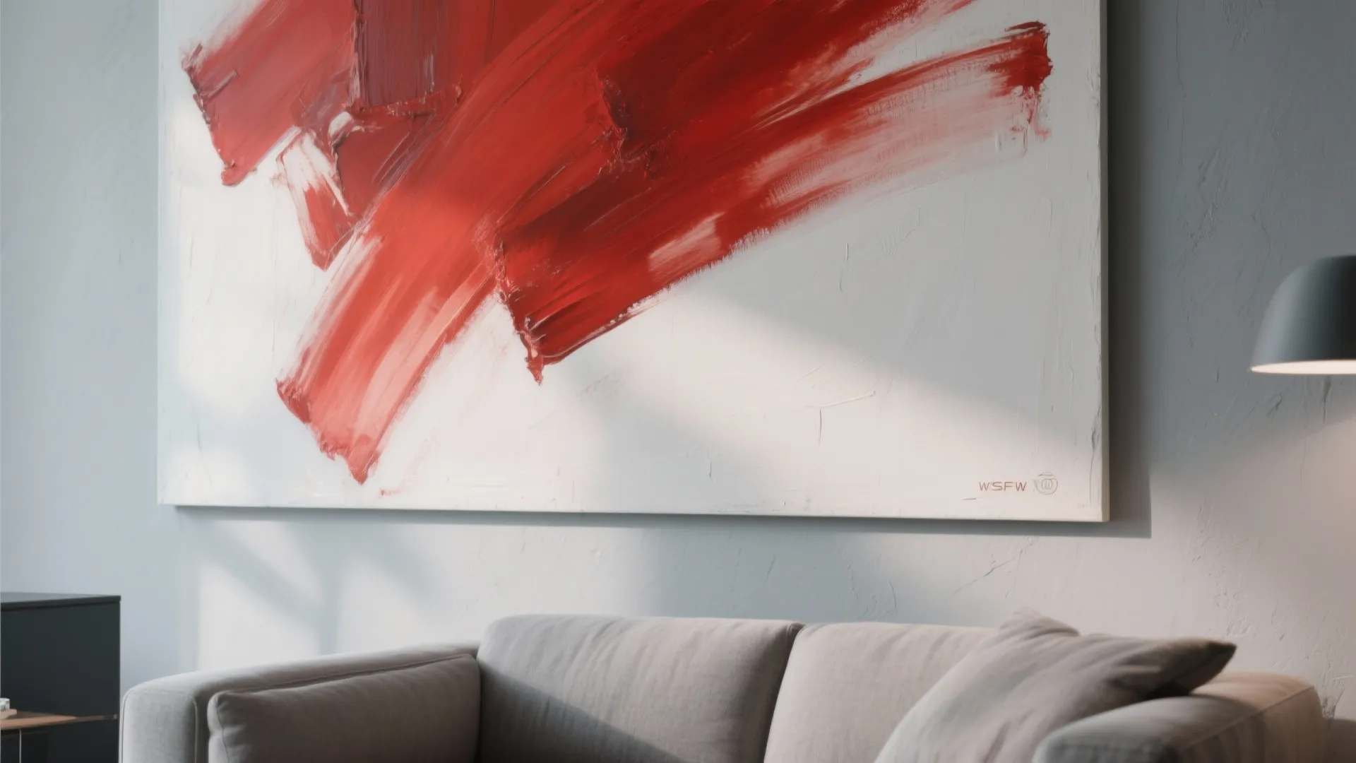 Abstract red artwork on gray living room wall