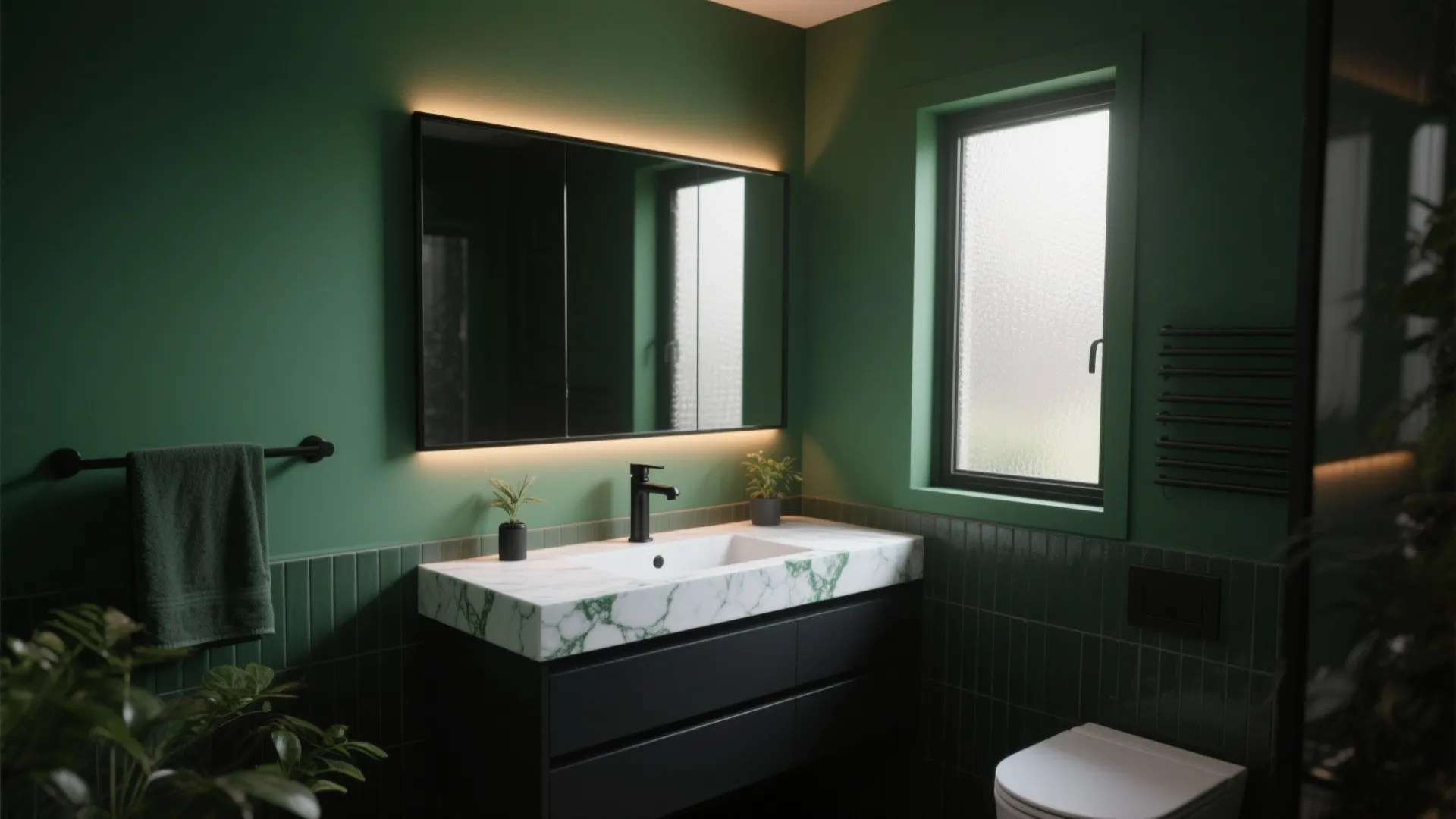 Green bathroom interior with black cabinet marble sink back lit mirror and frosted glass window