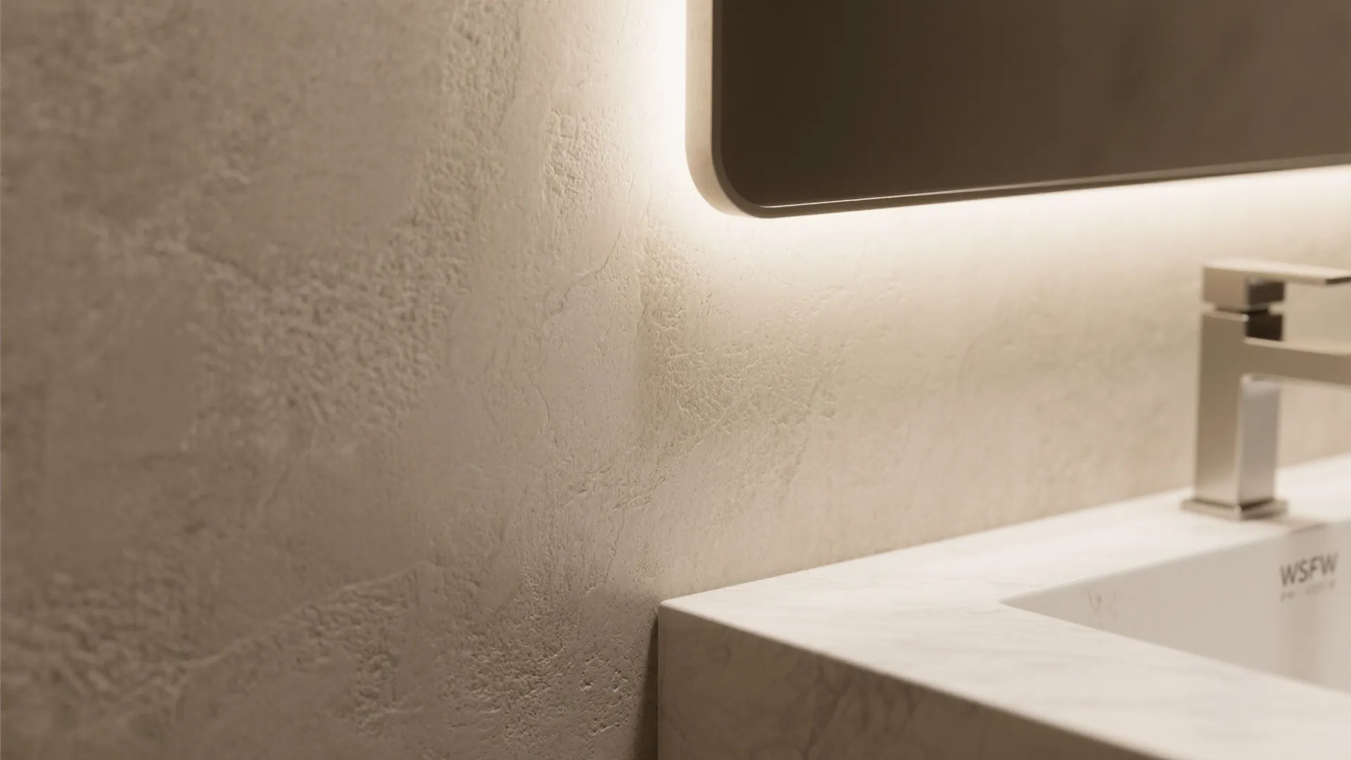 Macro view of greige microcement wall with soft matte texture and daylight highlights