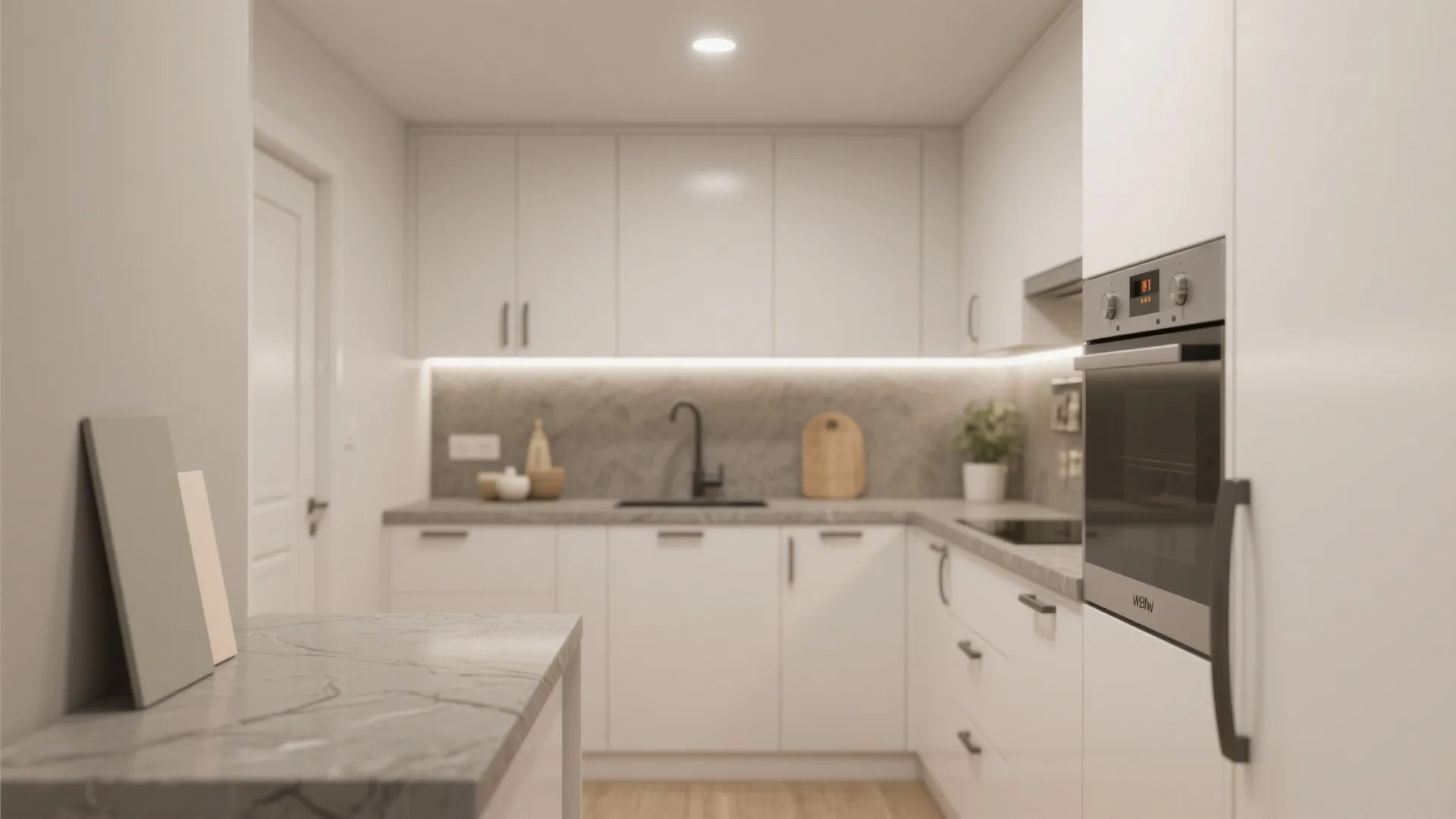 Small white kitchen layout featuring simple cabinets grey countertop built in oven and wood floors