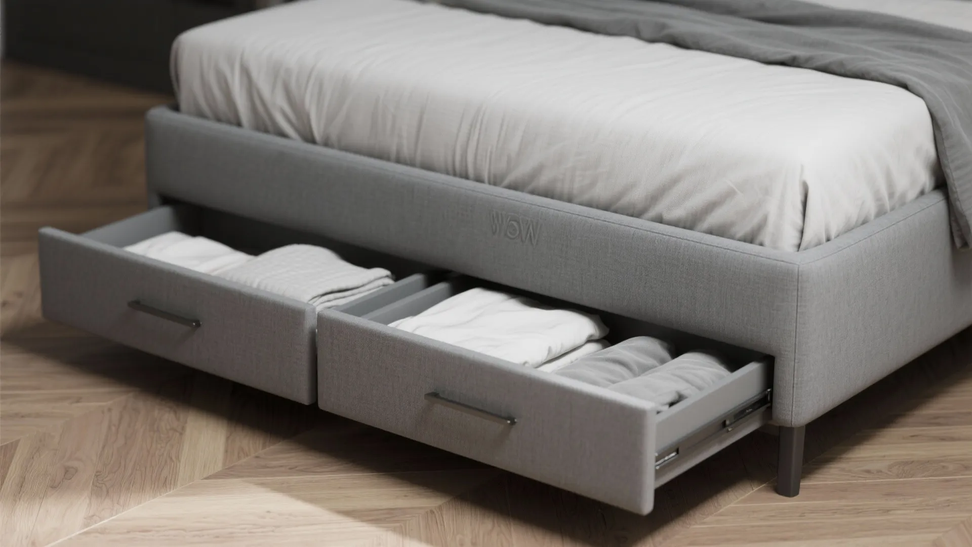 Close-up of grey low-profile queen bed with integrated under-bed drawers and soft-close slides.