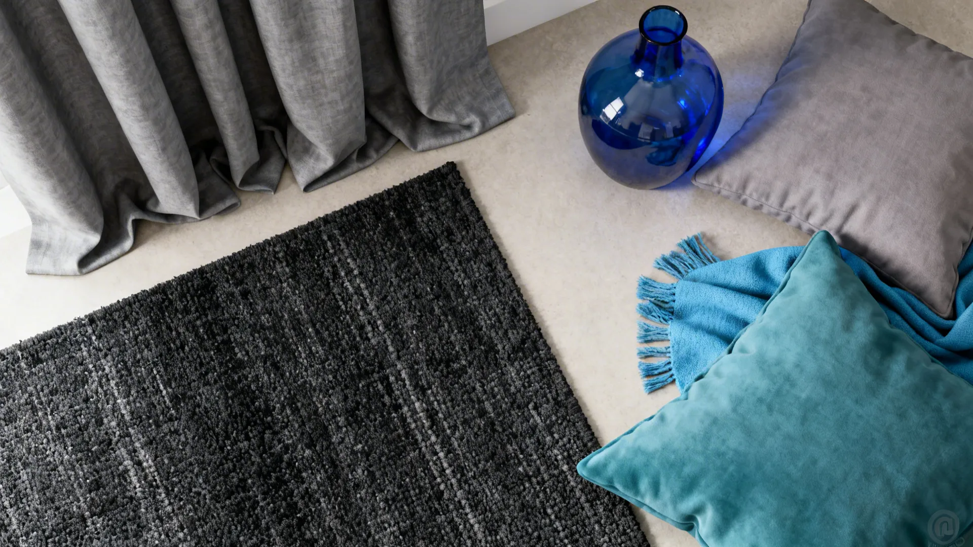 Flatlay of grey textile swatches with cerulean and teal accent pieces
