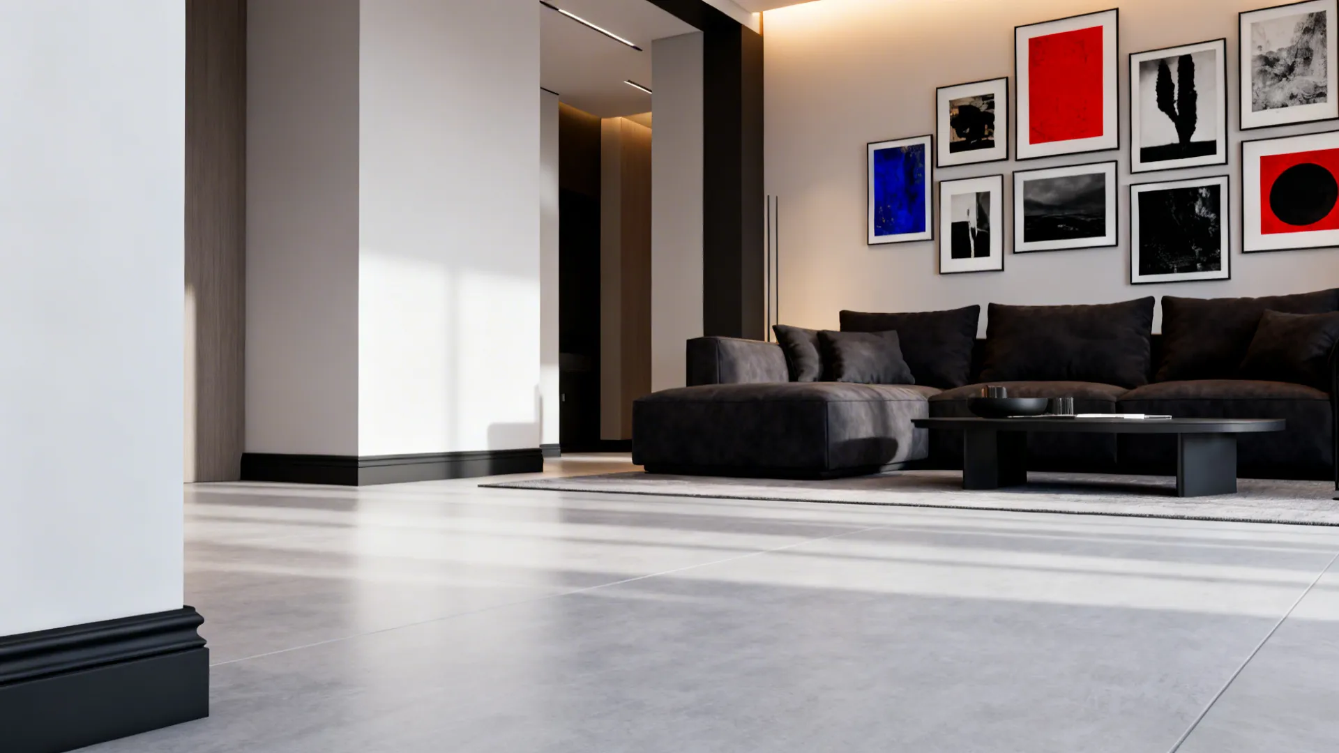 Living room with light grey floor contrasted by charcoal baseboards and a deep-colored sofa