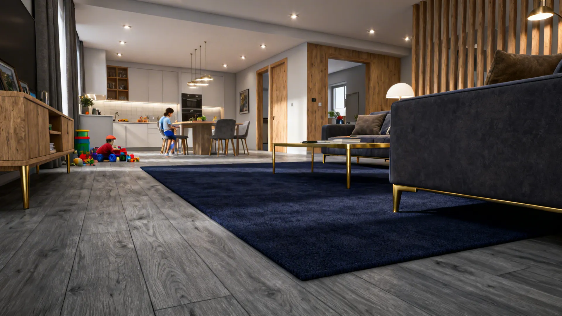 Open living area with grey engineered wood floors and a deep navy rug defining the seating area.