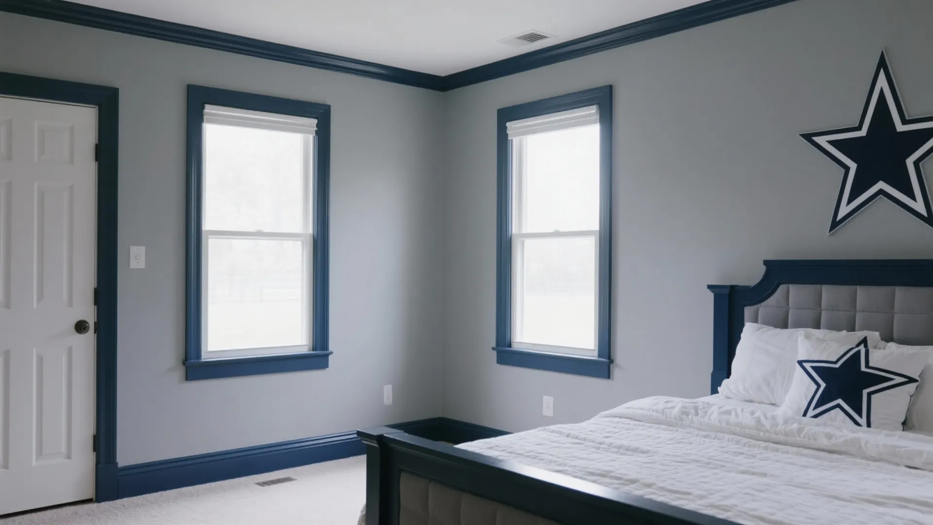 Grey bedroom with navy trim accents on windows and doors