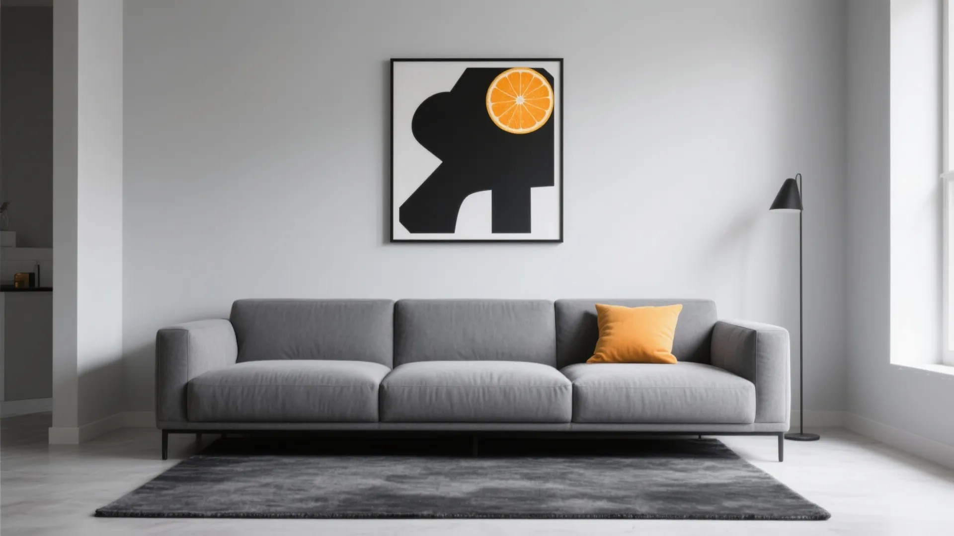 Grey sofa with orange pillow on dark rug under modern black and orange wall art