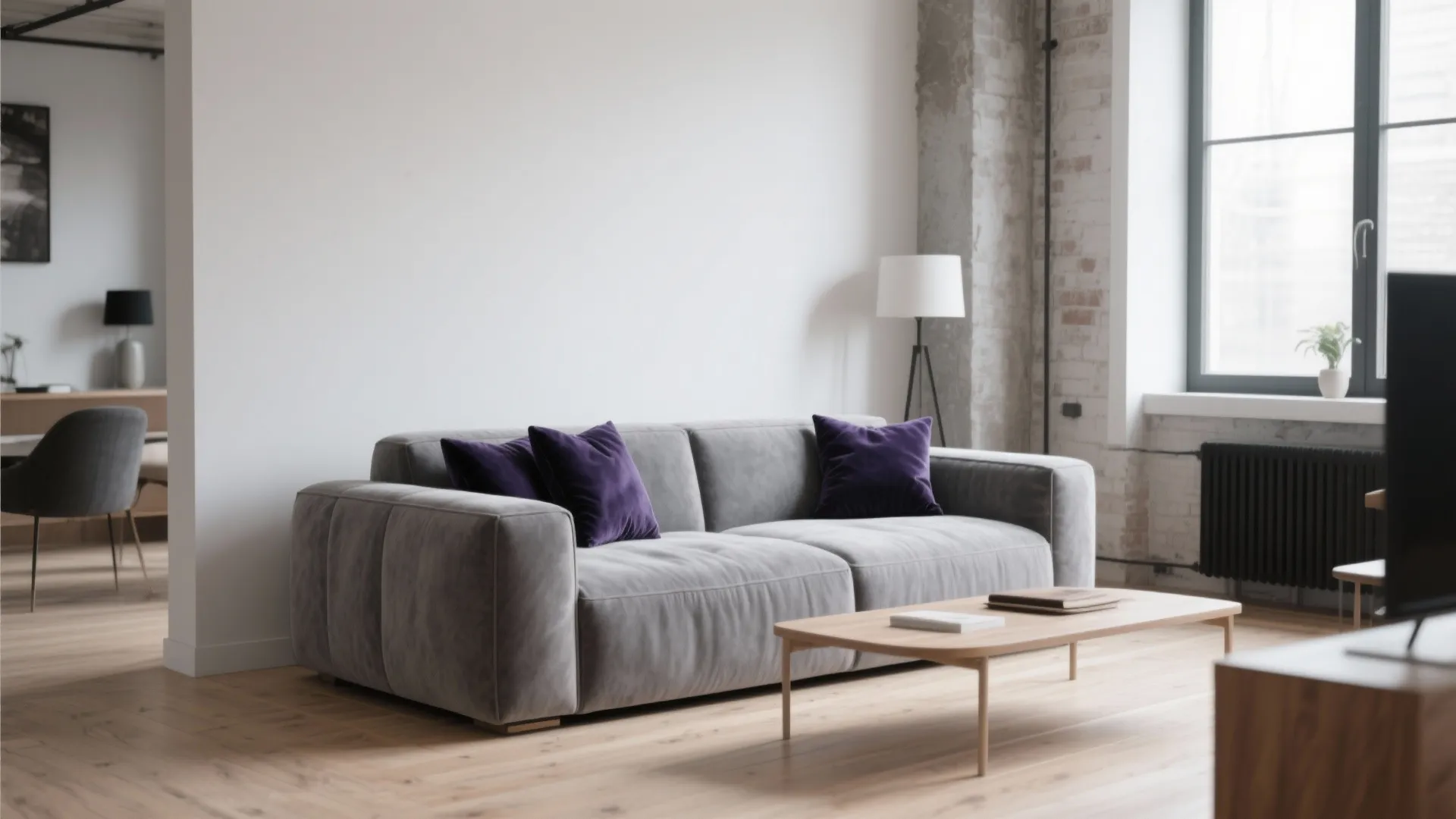 1. Minimalist Grey Sofa with Navy Accents
