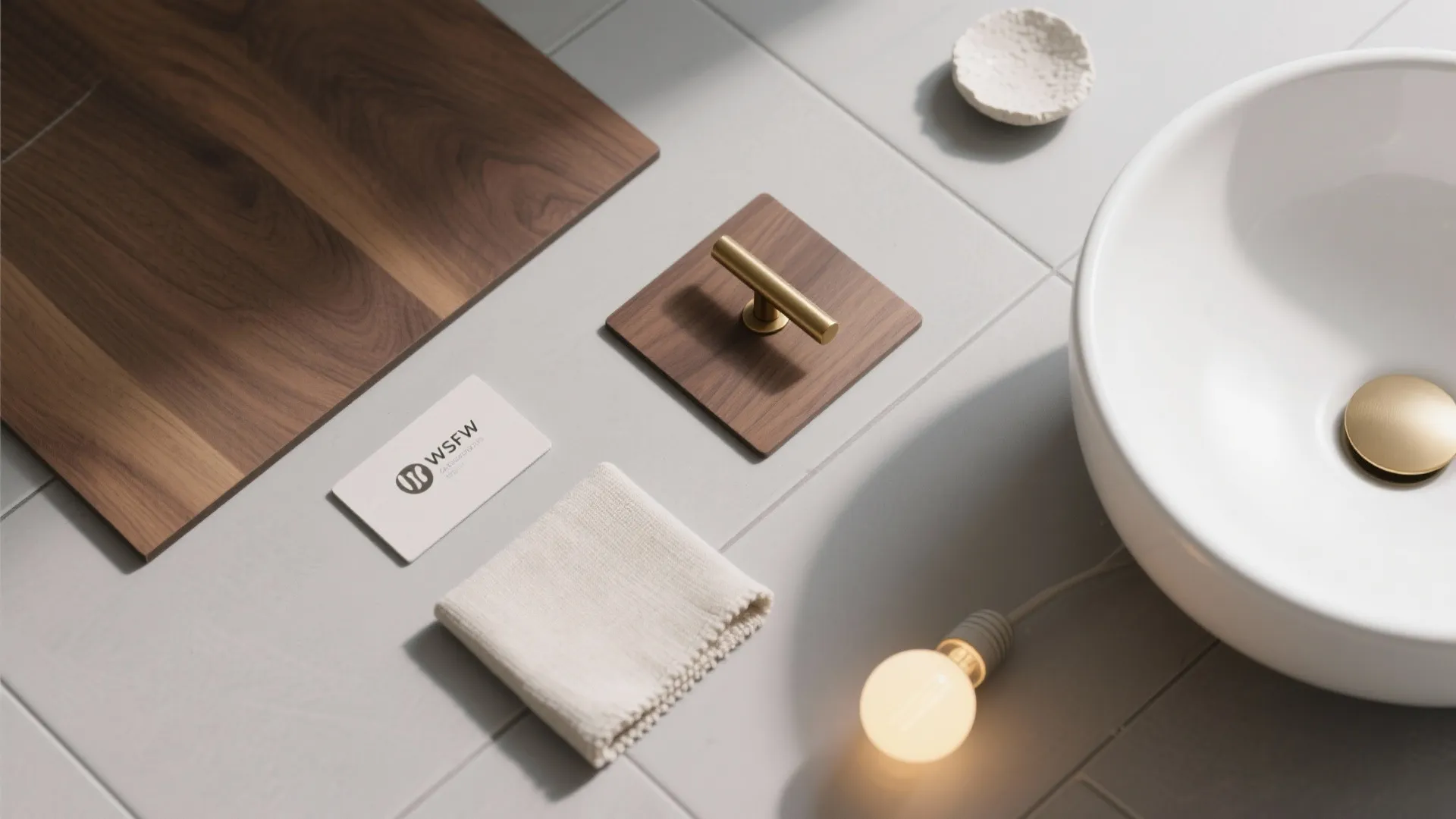 Interior design materials with wood panel white sink gold handle small towel and light bulb