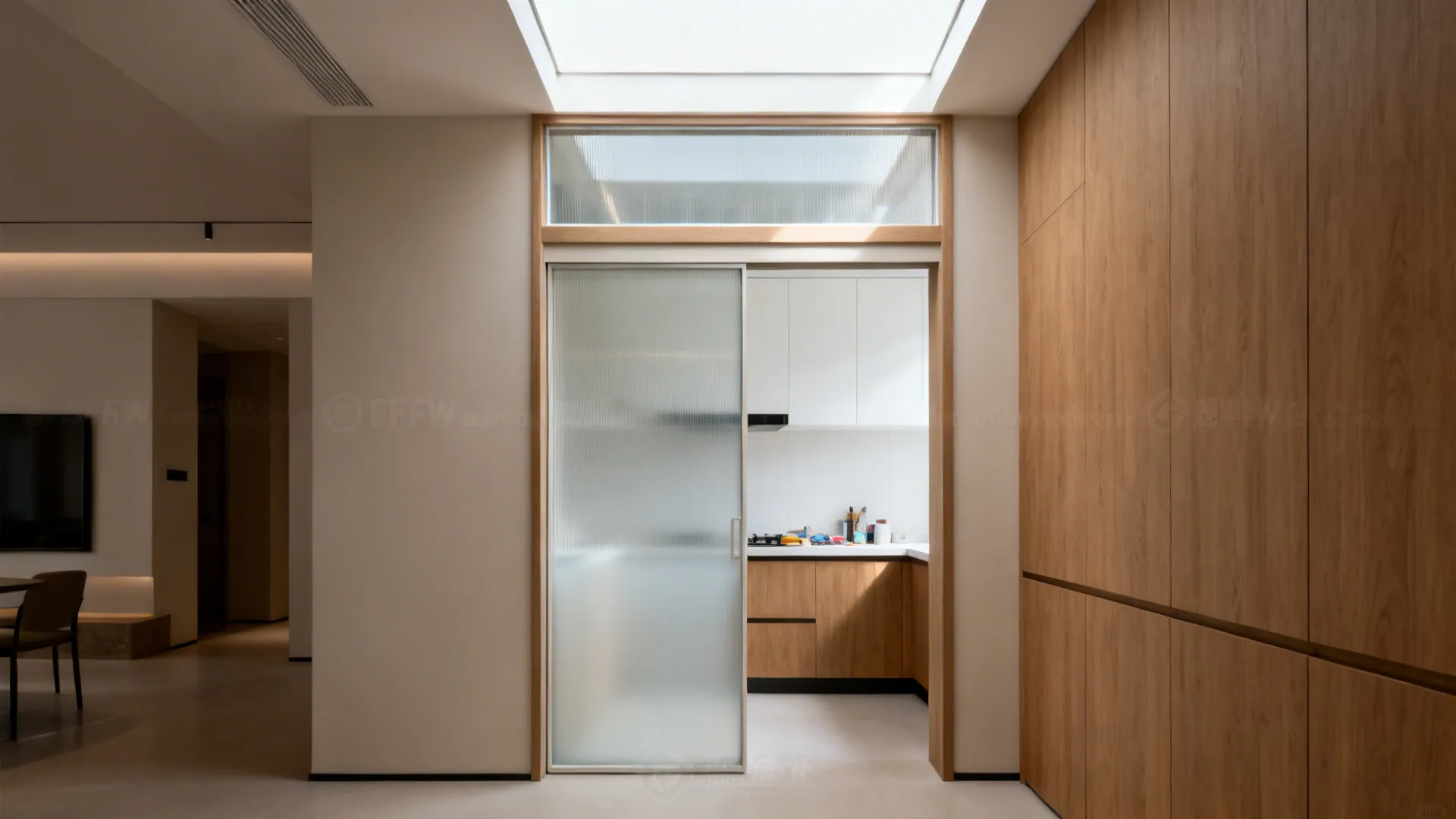 Half-frosted kitchen door with a clear top band aligned to cabinet lines, spreading daylight.