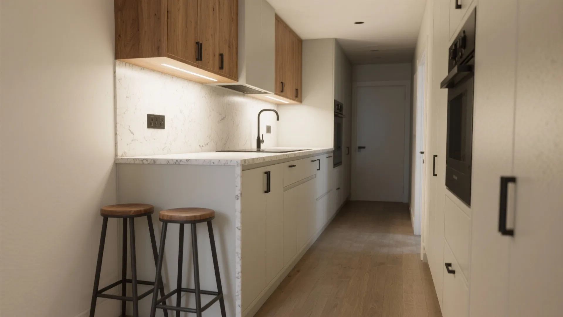 Half-peninsula island attached to a counter in a galley kitchen with tucked stools and clear aisle.