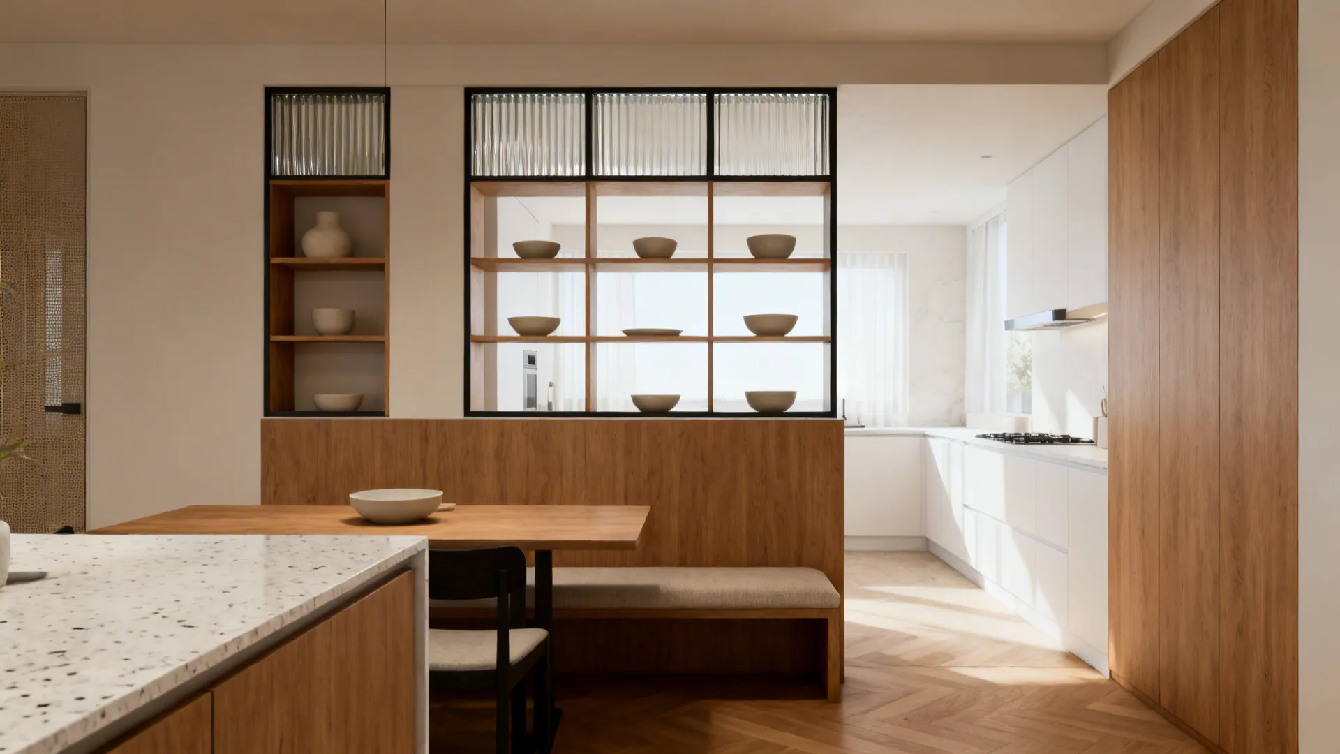 Open kitchen and dining zoned by a half wall with shelves and fluted glass frame.