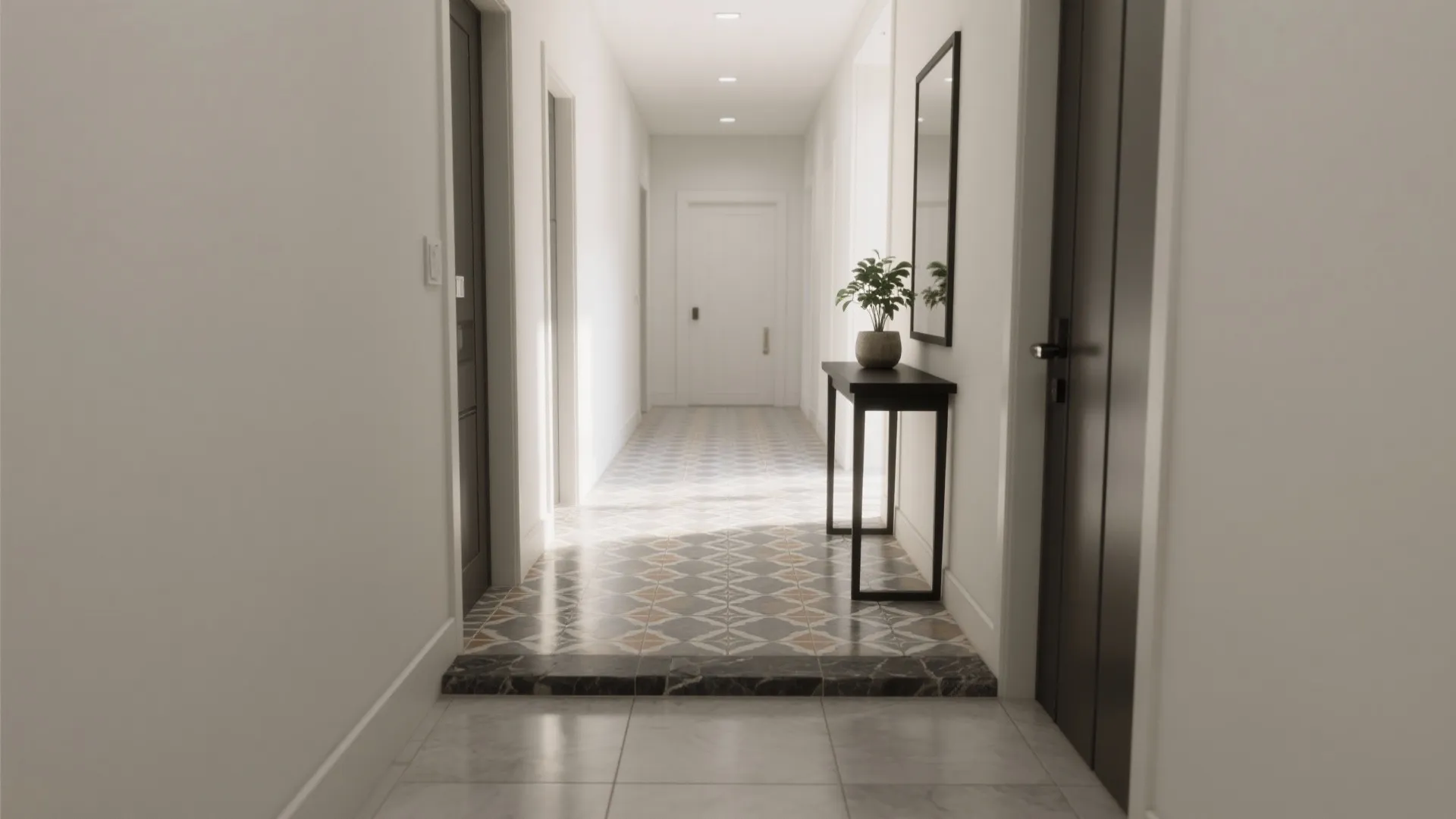 Long white hallway with patterned floor tiles a small black table with plant and mirror