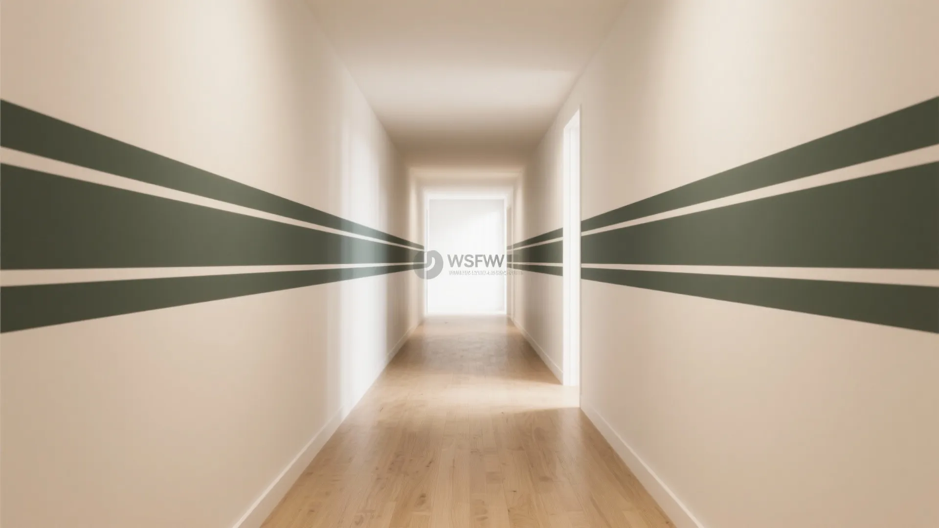 Long narrow hallway featuring green horizontal stripes on white walls with light colored wood flooring