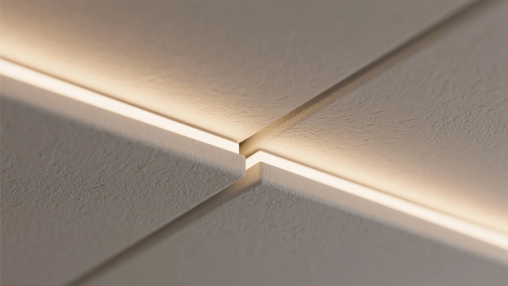 Close up view of light fixture glowing through a narrow gap between white wall panel surfaces