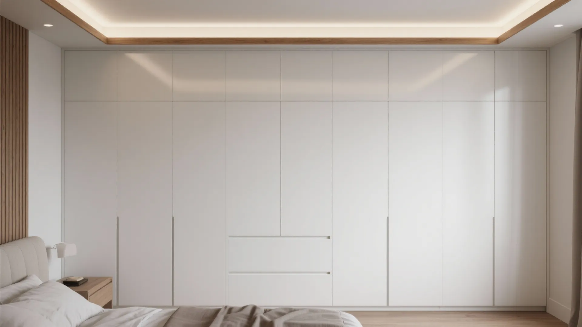 Modern white floor to ceiling wardrobe with hidden handles in a minimalist wooden bedroom design