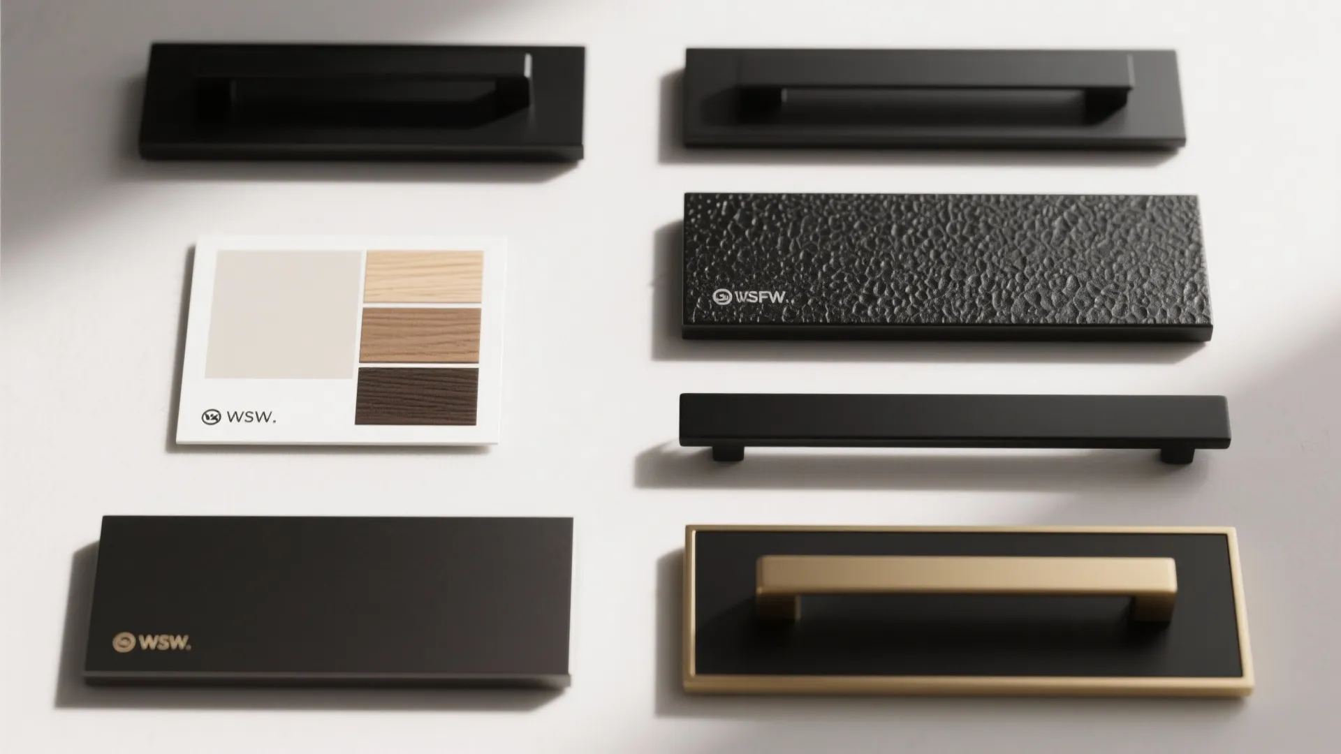 Collection of modern black and gold cabinet handles and knobs with wood color sample cards