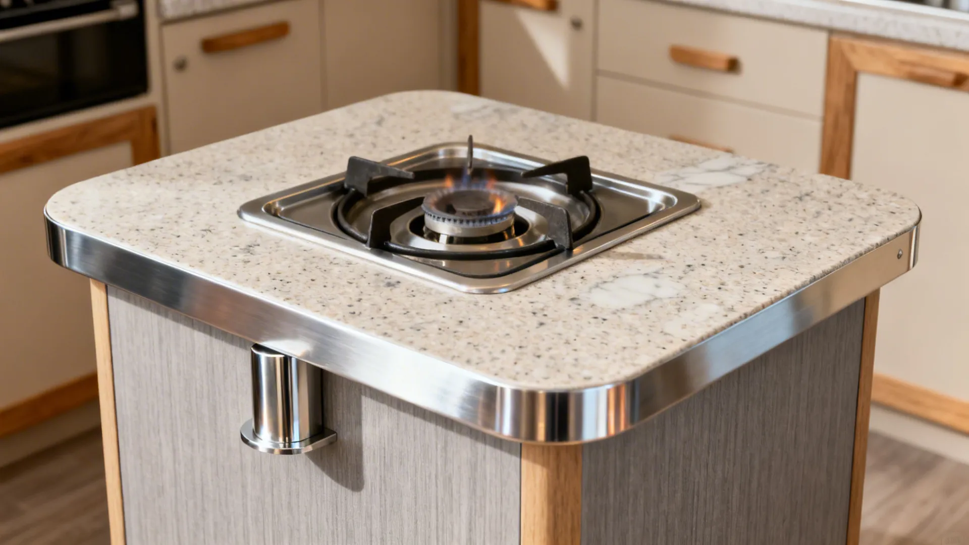 Gas cooktop set in quartz with stainless edge trim and compact laminate, showing protected cut-out and durable materials.