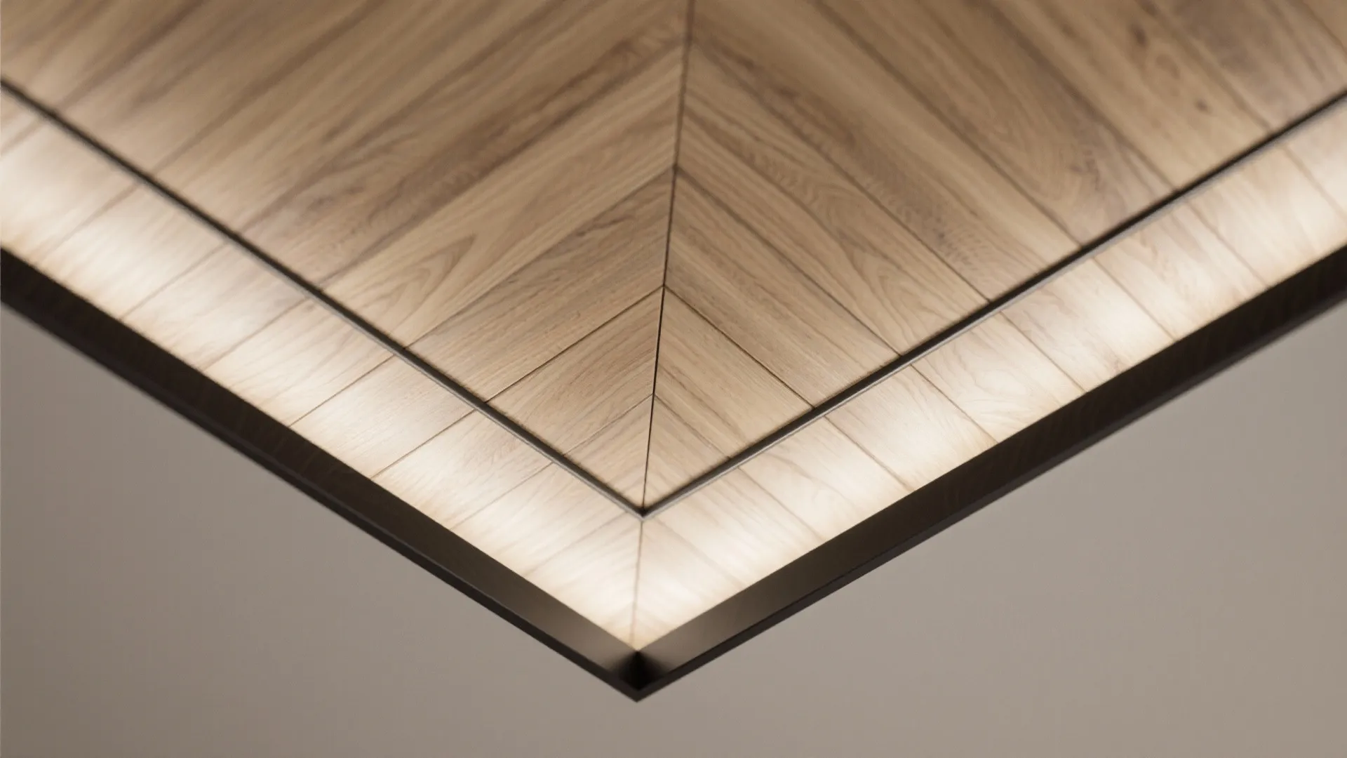 Macro of chevron veneer joints on ceiling with crisp shadow gap border.