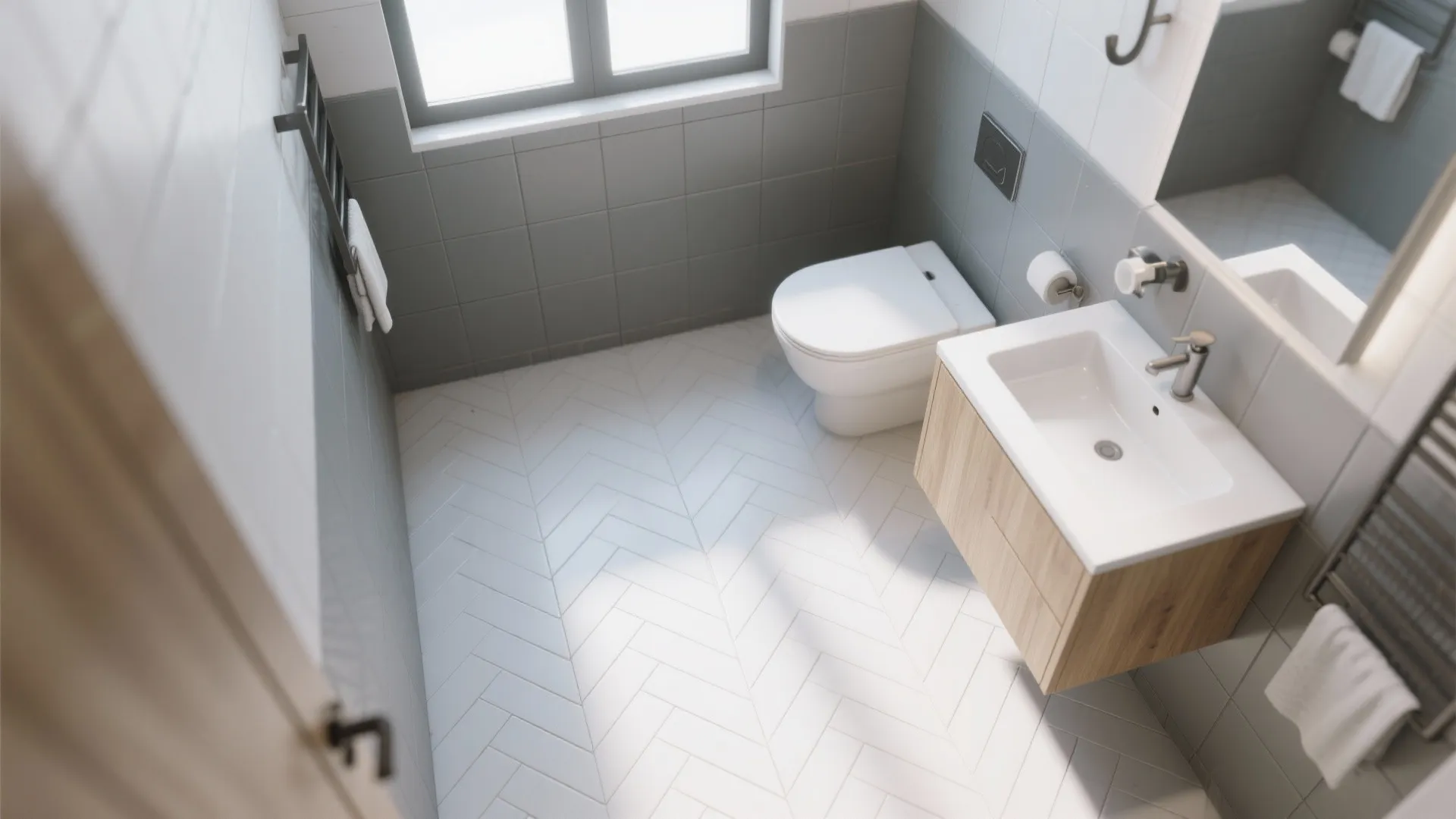 Small bathroom with grey wall tiles white sink wooden cabinet and white herringbone pattern floor