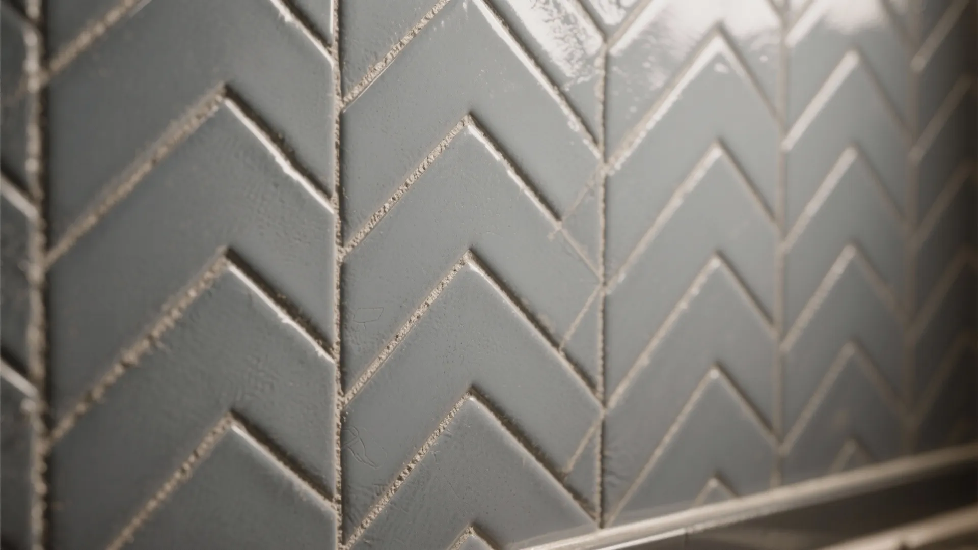 1. Mid-gray subway tiles laid in herringbone