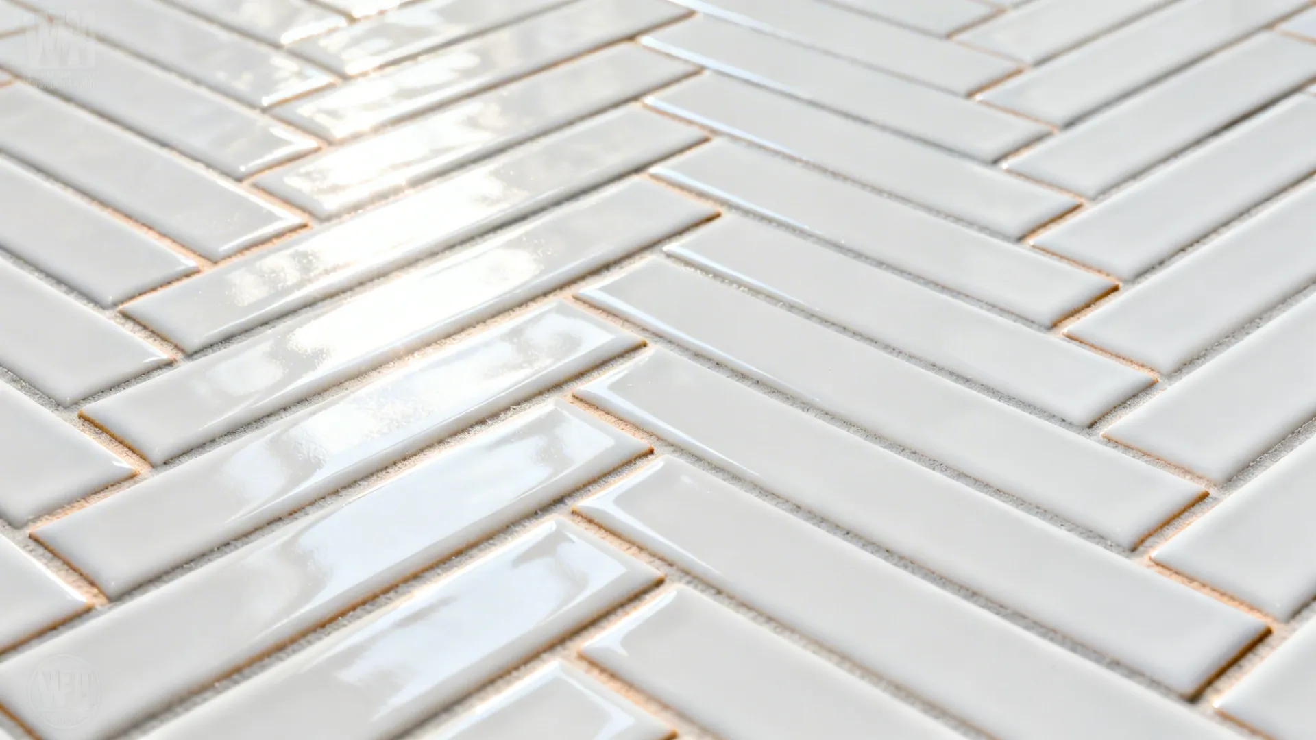 Macro of glossy white herringbone tiles with light gray grout and crisp edges.