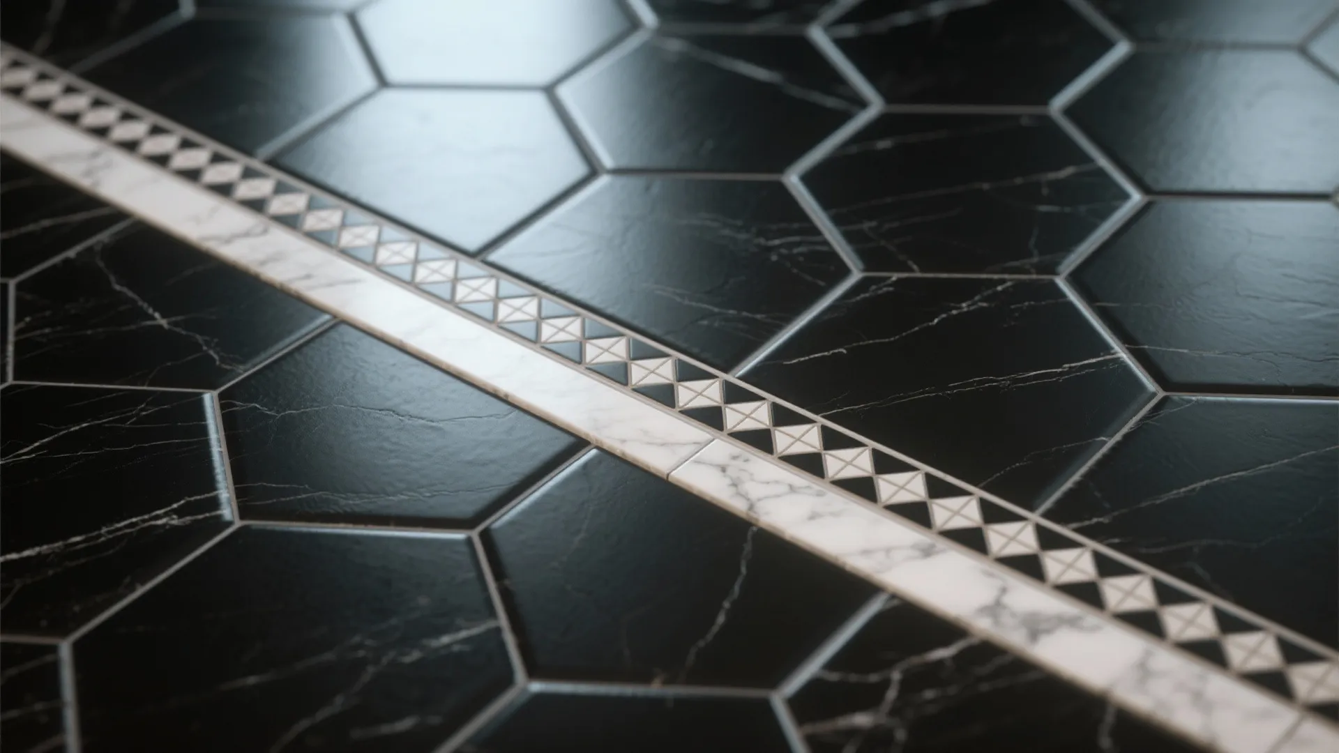 Close-up of black hexagon tiles with a smaller-hex patterned border and marble trim