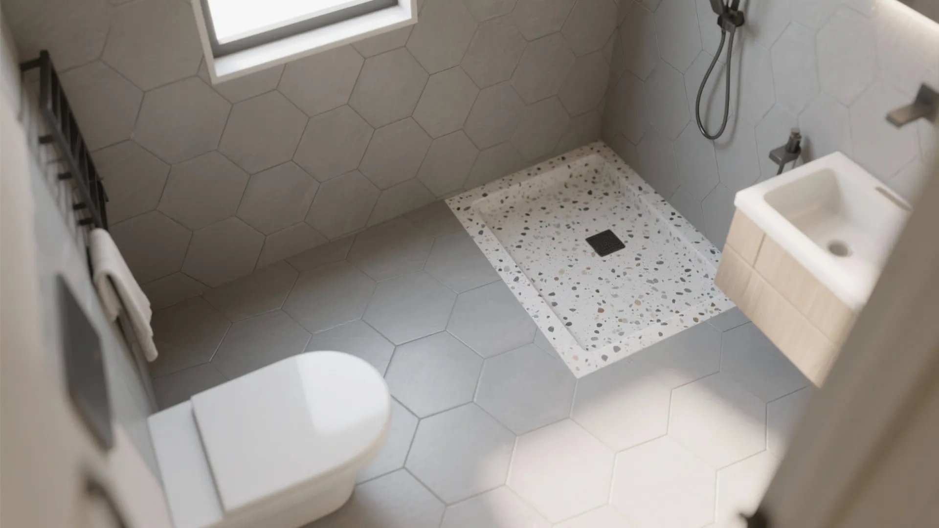 Top-down view of soft grey hexagon floor with a terrazzo-look shower pan, unified by one grout tone.