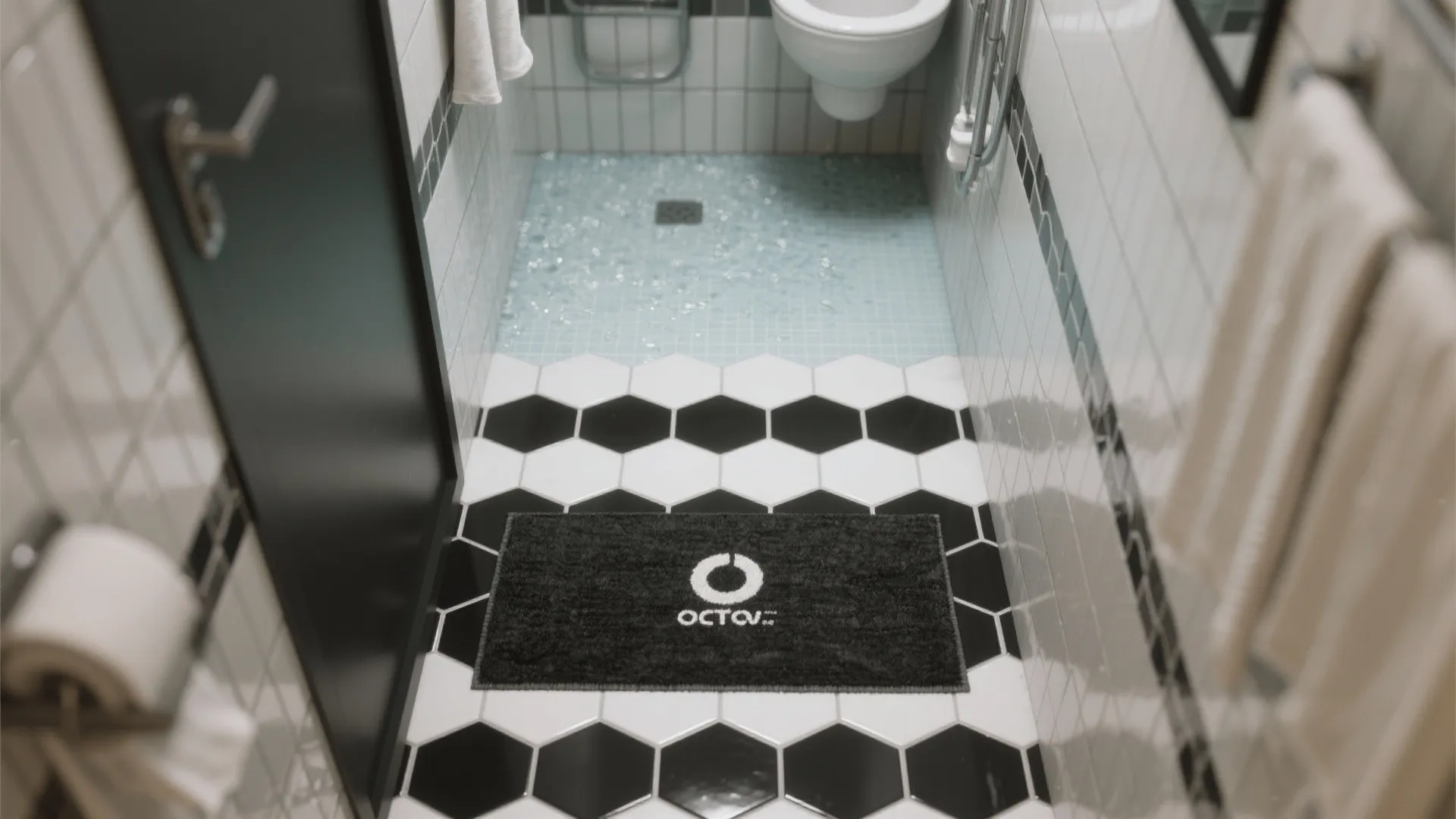 3. Use patterned black hex tiles to create zones in small baths