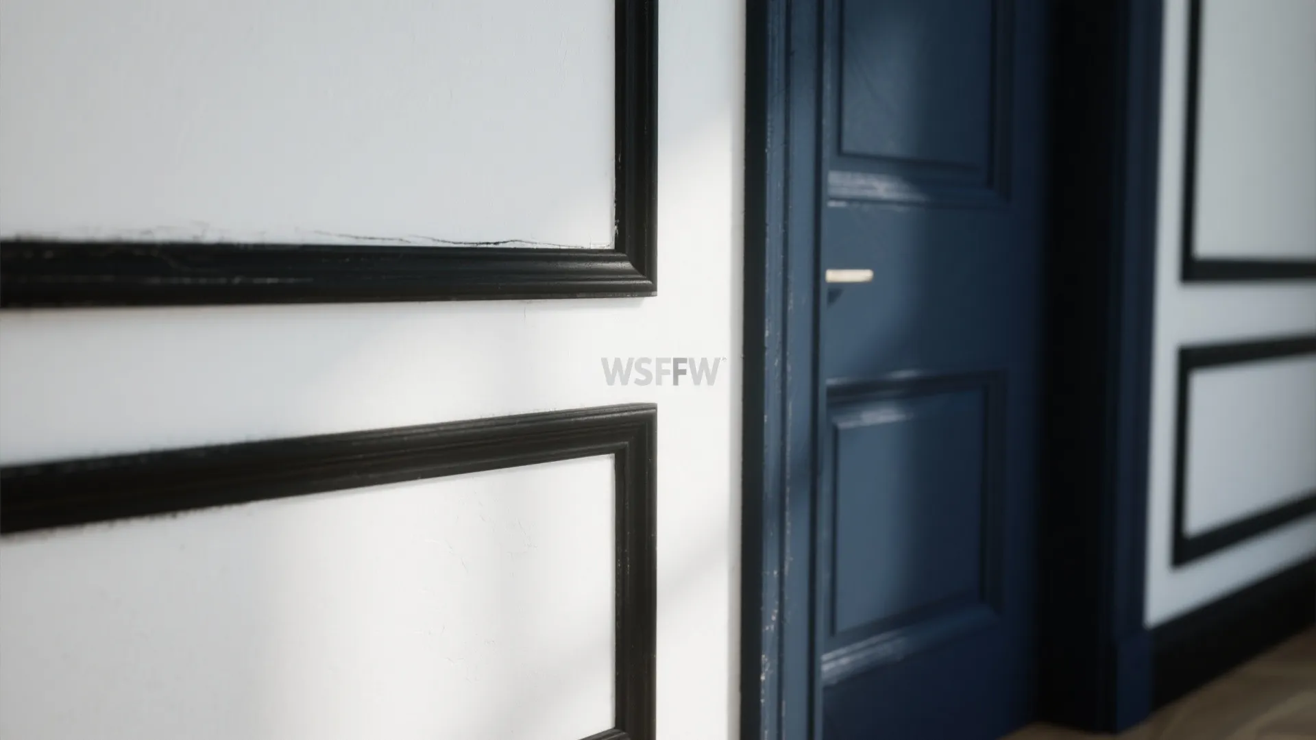 Close up of white wall panel with black trim next to a dark blue door
