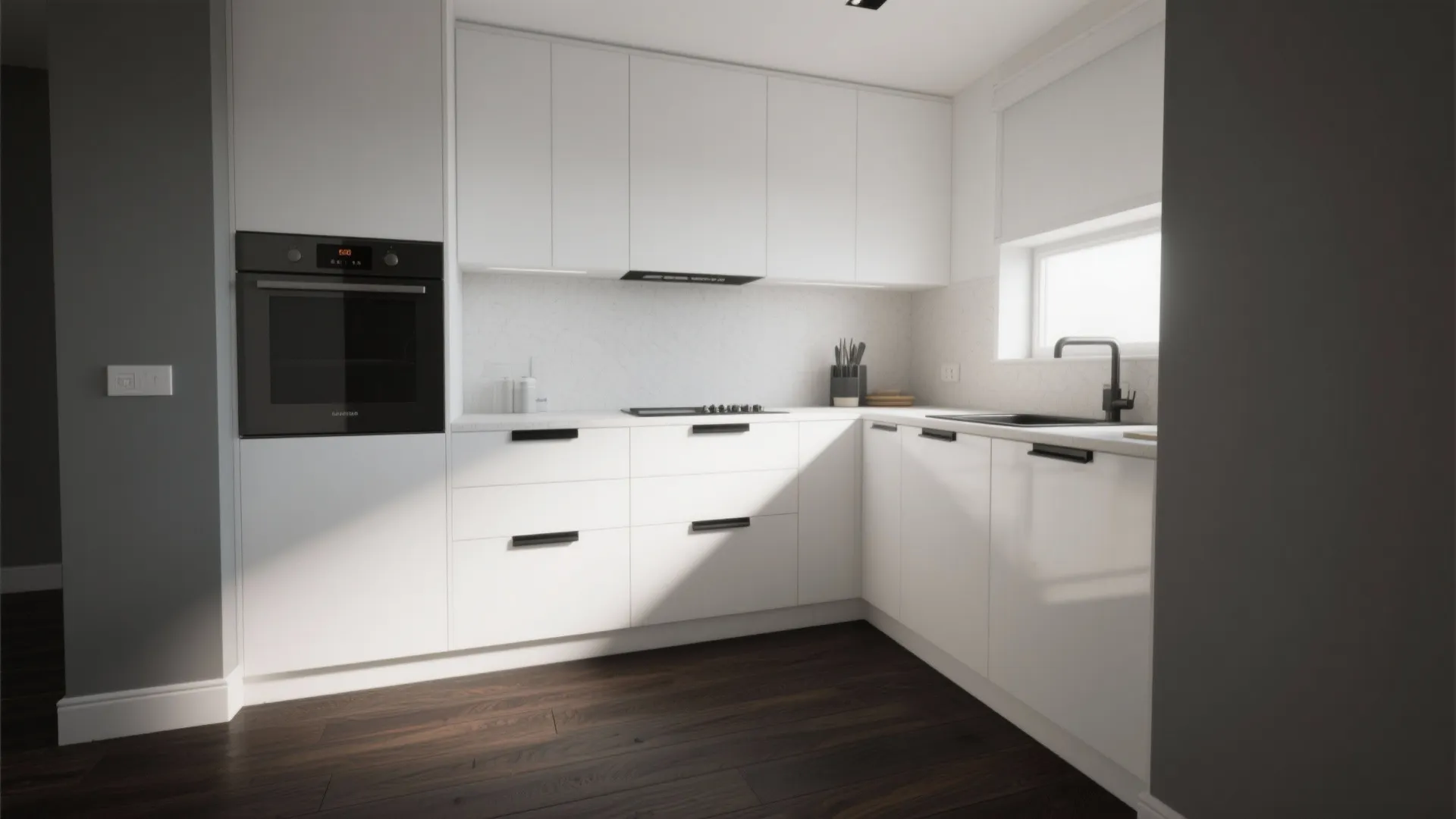 Minimalist white kitchen featuring black handles built in oven dark wood flooring and natural light