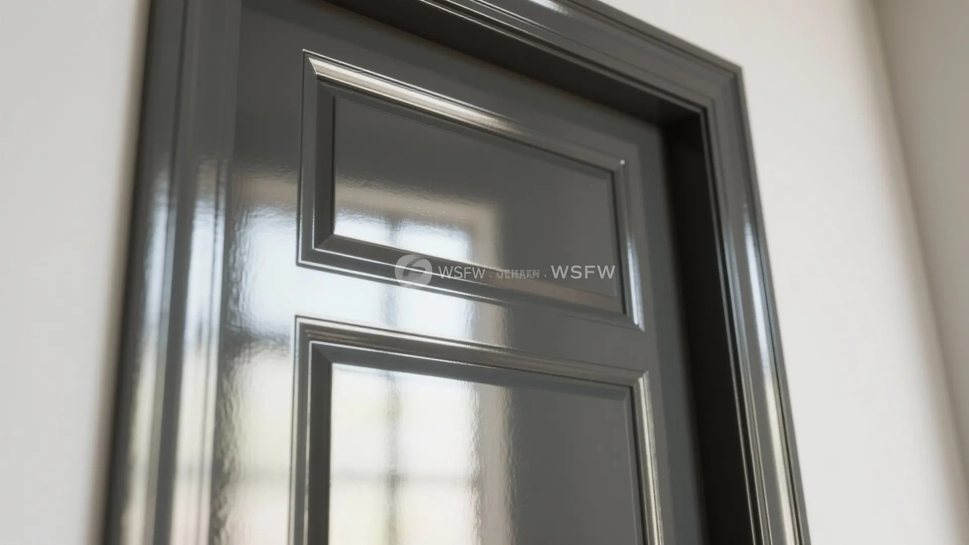 Close up of a dark grey door featuring a very shiny high gloss paint finish