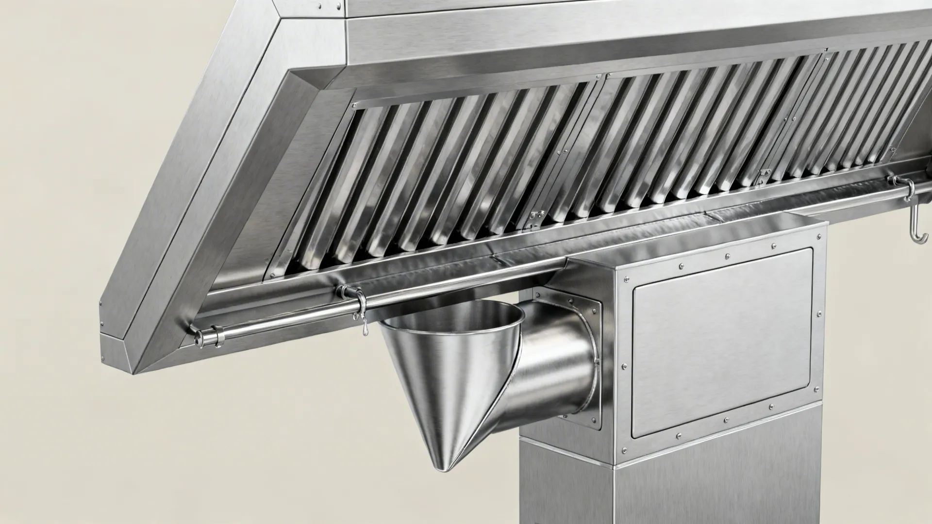 Macro detail of hood section with double-wall duct, 45° filters, drip rail, and cleanout access.