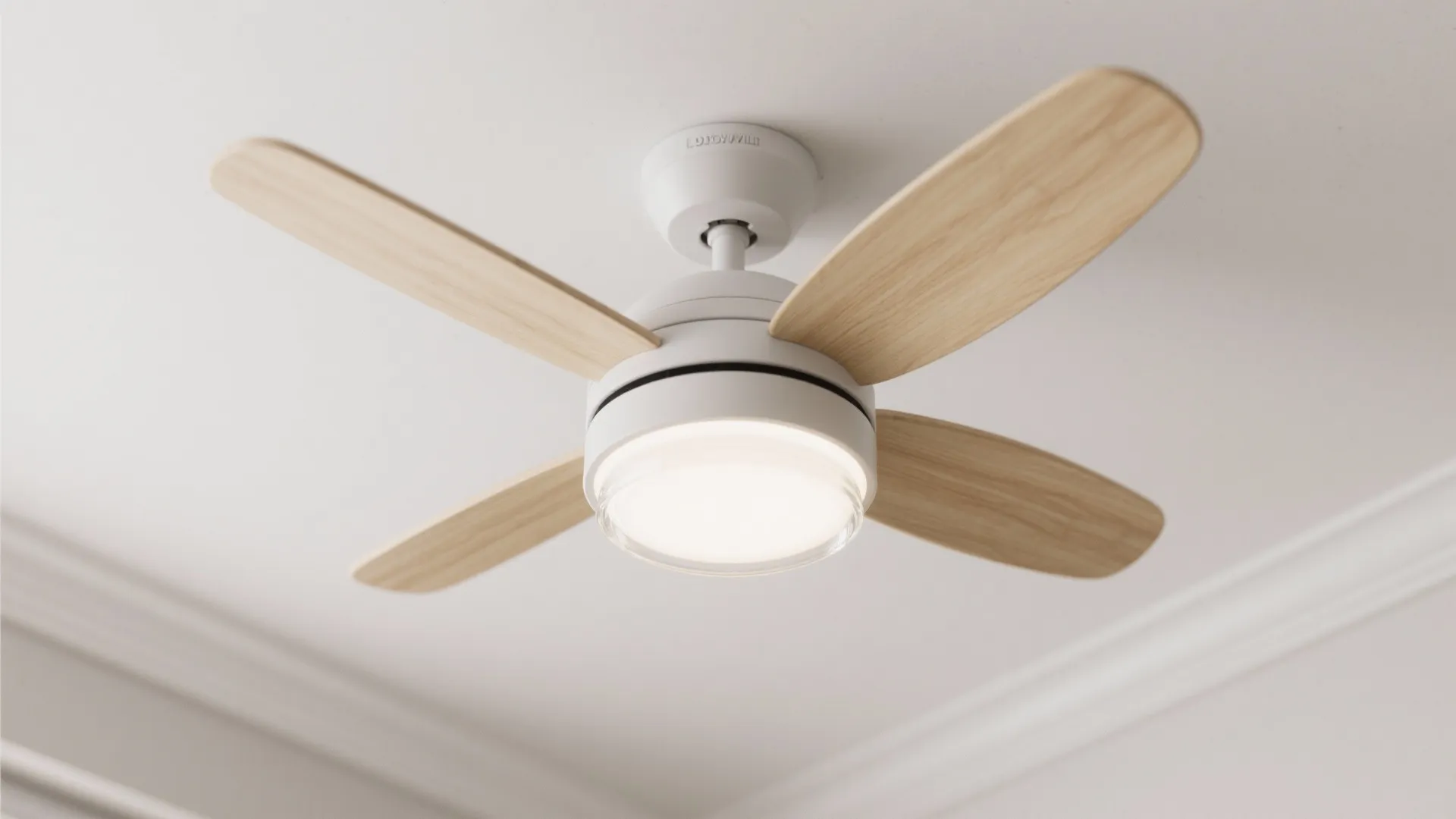 Close up of a modern white ceiling fan with four wooden blades and a light