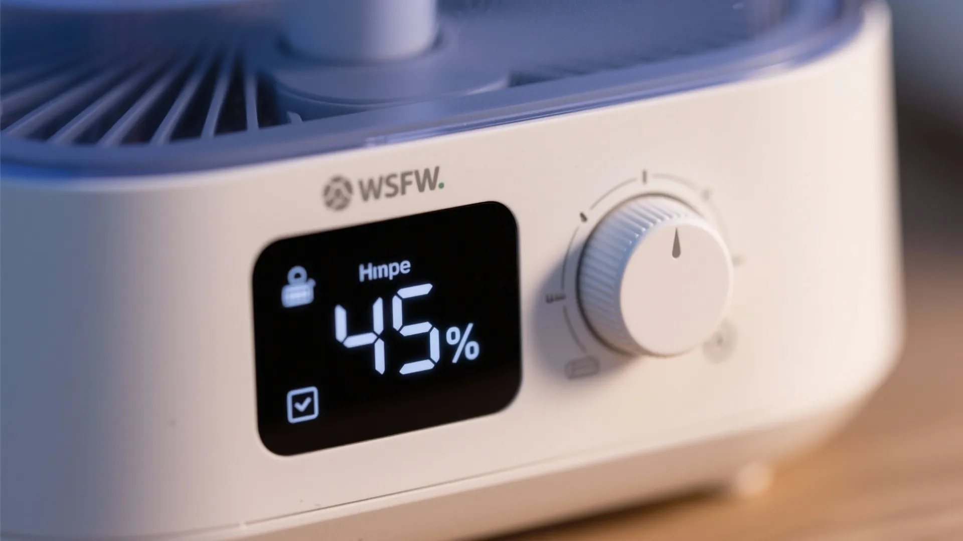 Close-up of a humidifier control dial and display set to 45% humidity.
