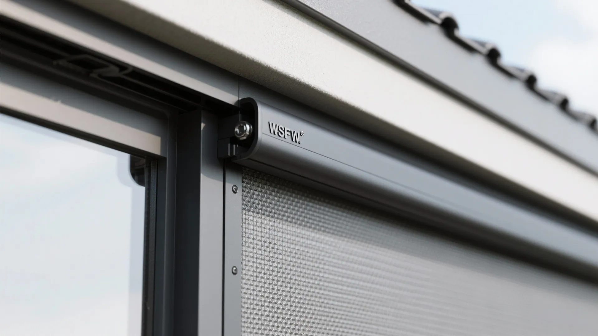 Close up of grey window frame with screen and metal hardware detail on a clean wall