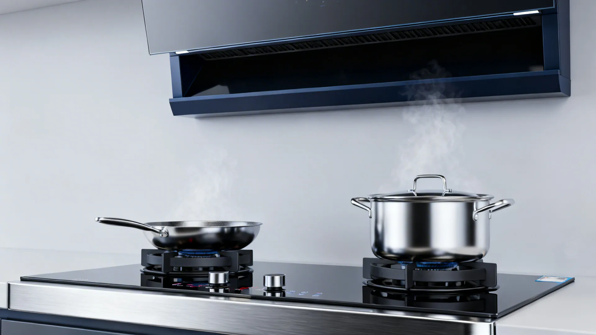 Macro view of induction cooktops with recessed hood and baffle filters in a luxury kitchen.