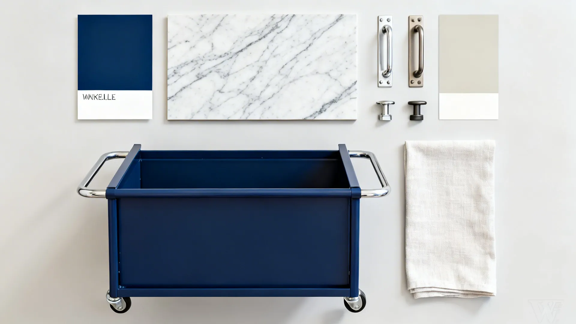 Top-down flat lay of navy paint, marble-look laminate, nickel hardware, and light linen