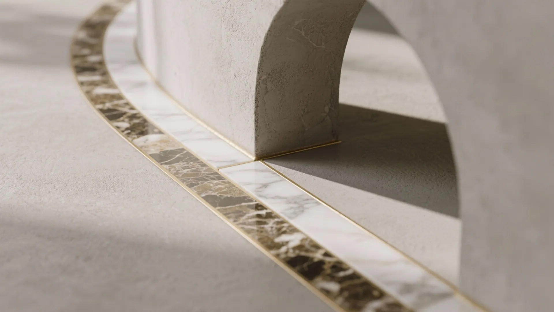 Close view of curved marble floor design with gold metal trim under a grey stone archway