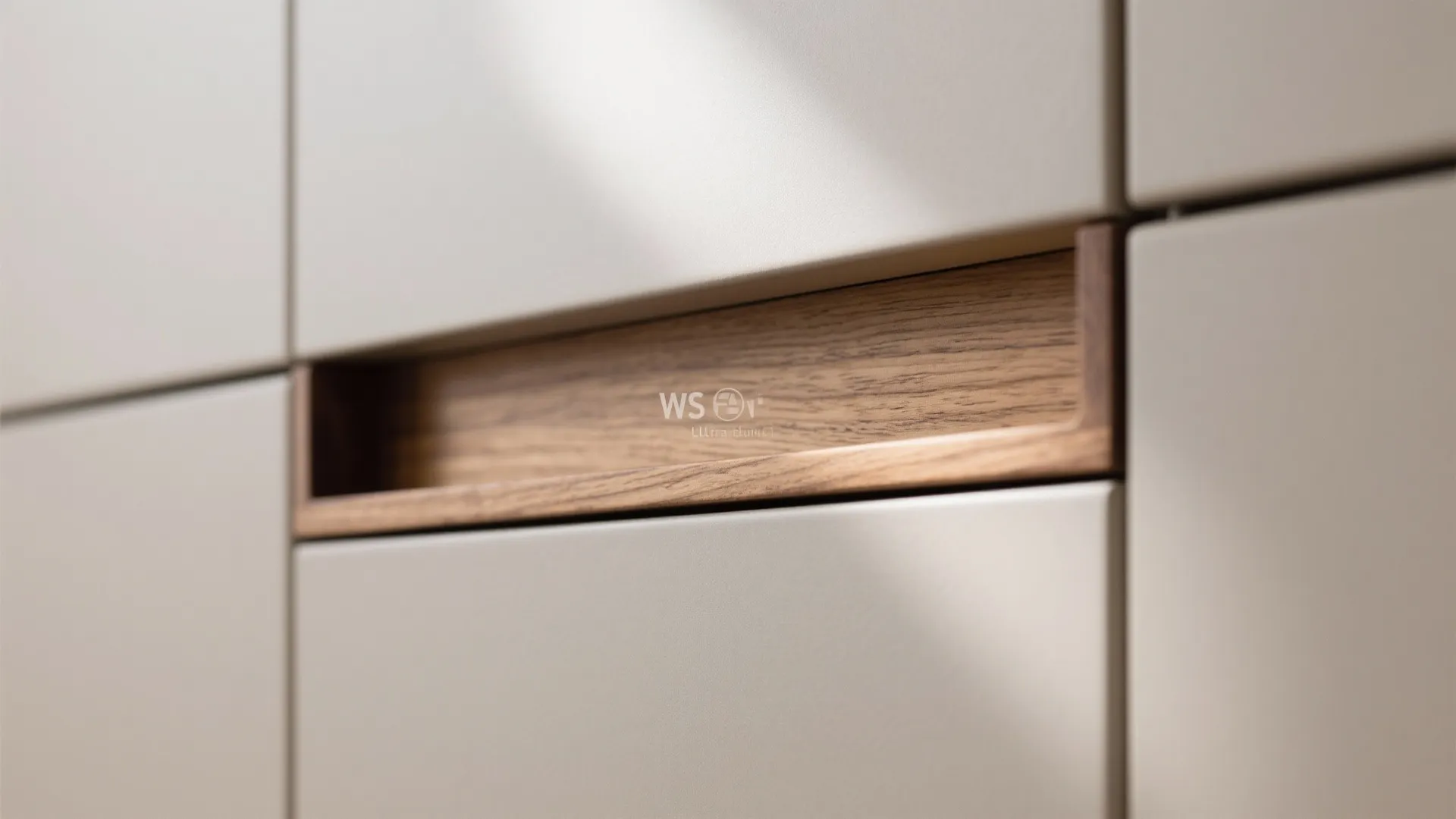 Close up of modern white cabinet door featuring an integrated wooden handle with natural wood grain