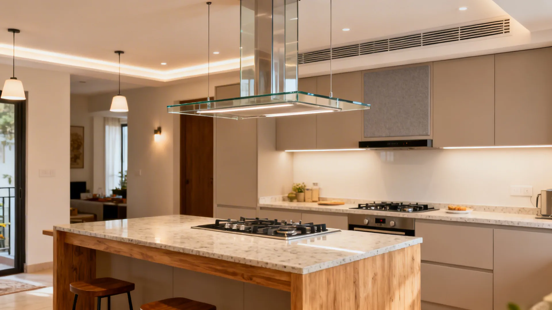 Glass-canopy island chimney with diffused lighting over a compact breakfast counter.