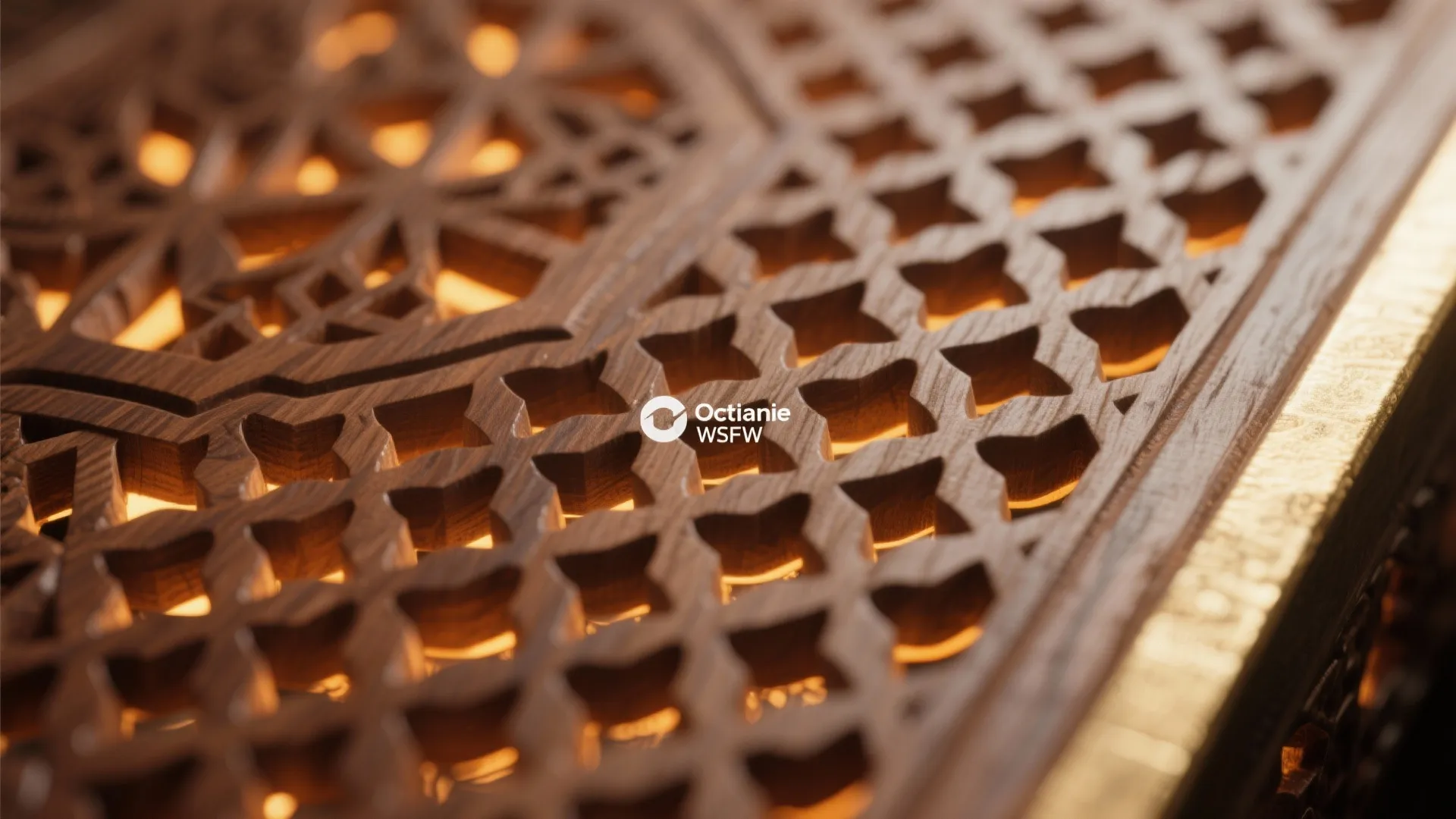 Close up of carved wooden wall panel with light shining through the small decorative geometric holes