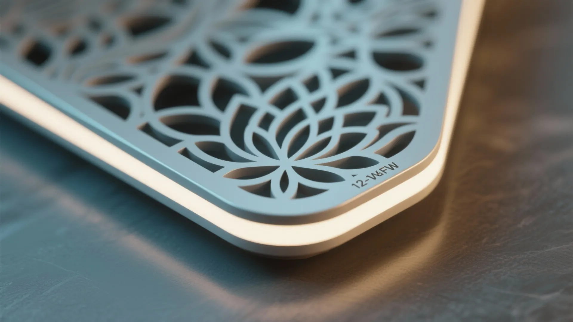 Close up of decorative wall panel with flower pattern white light strip and grey background