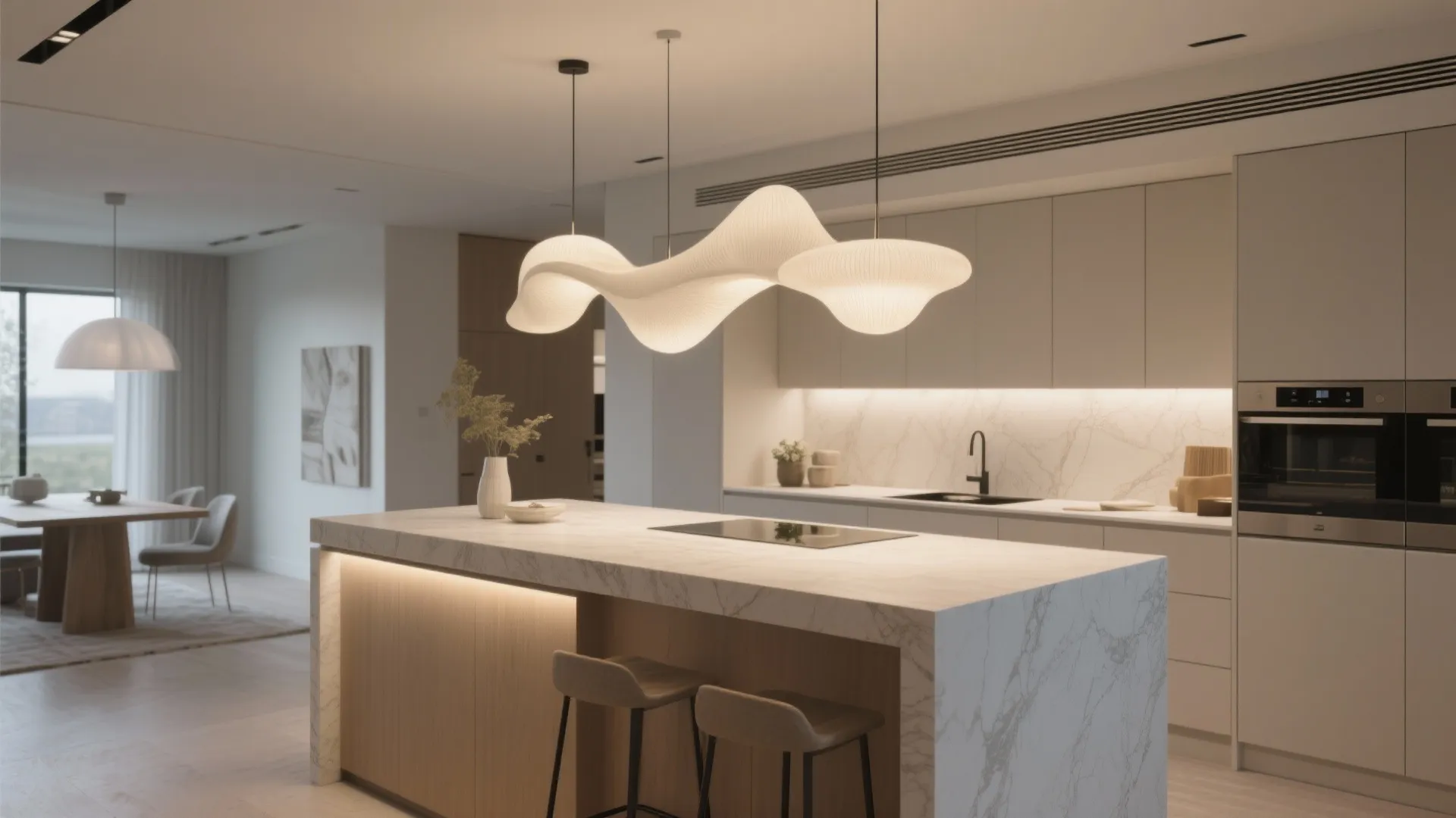 Modern kitchen with white marble island and unique wavy ceiling light above the breakfast bar