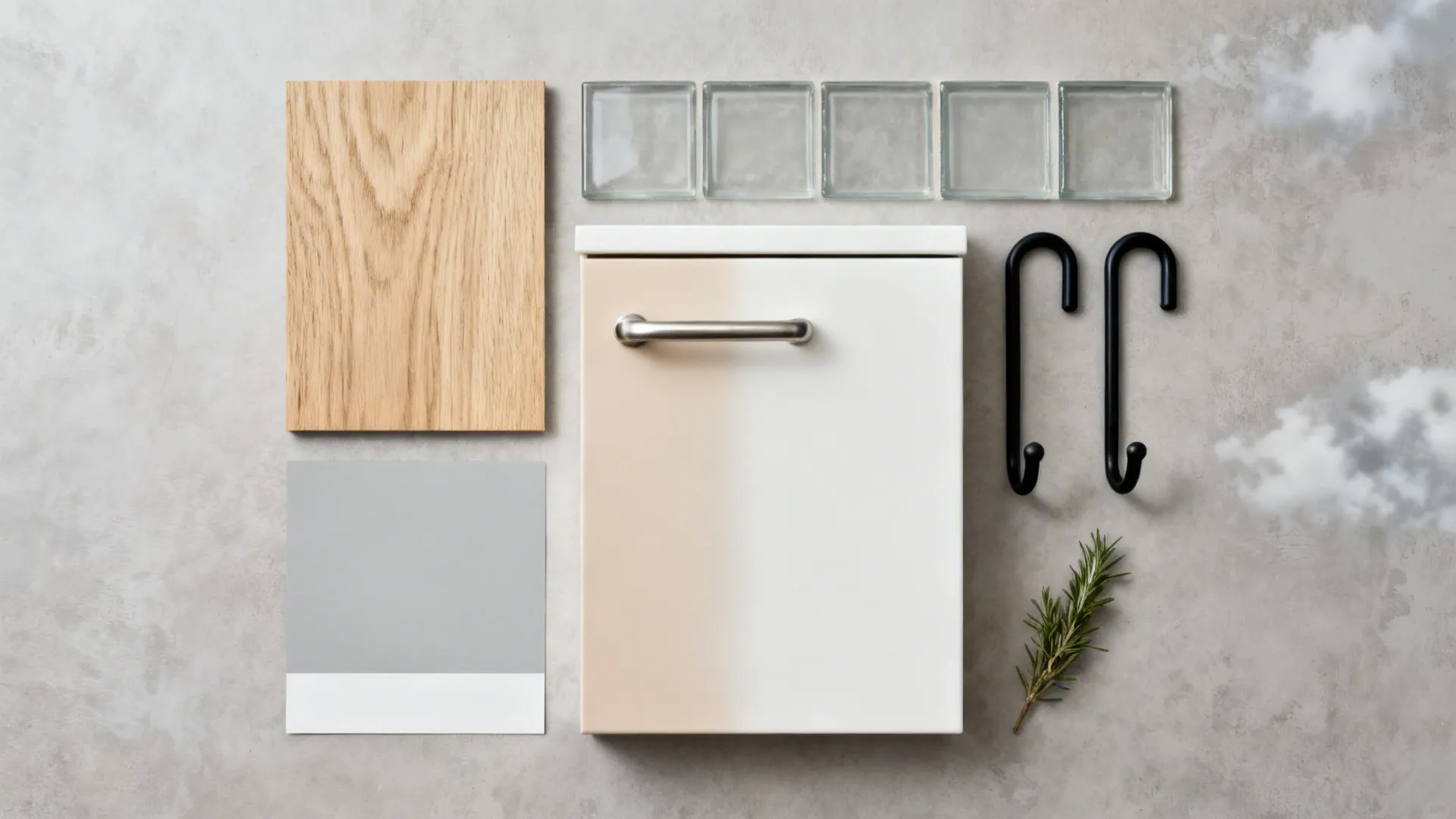 Top-down flat lay of oak, white cabinet fronts, stainless hardware, glass tile, and paint chips.