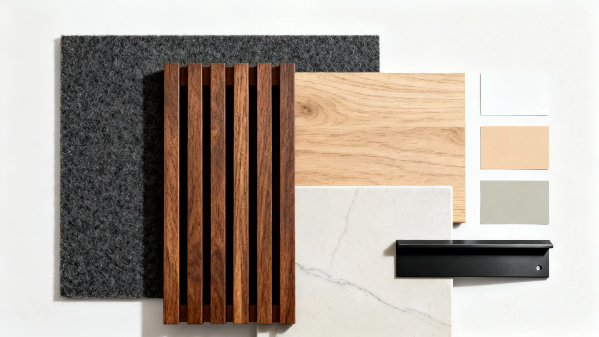 Flat lay of walnut slat and felt, oak veneer, satin porcelain slab, matte black metal, and neutral paint chips.