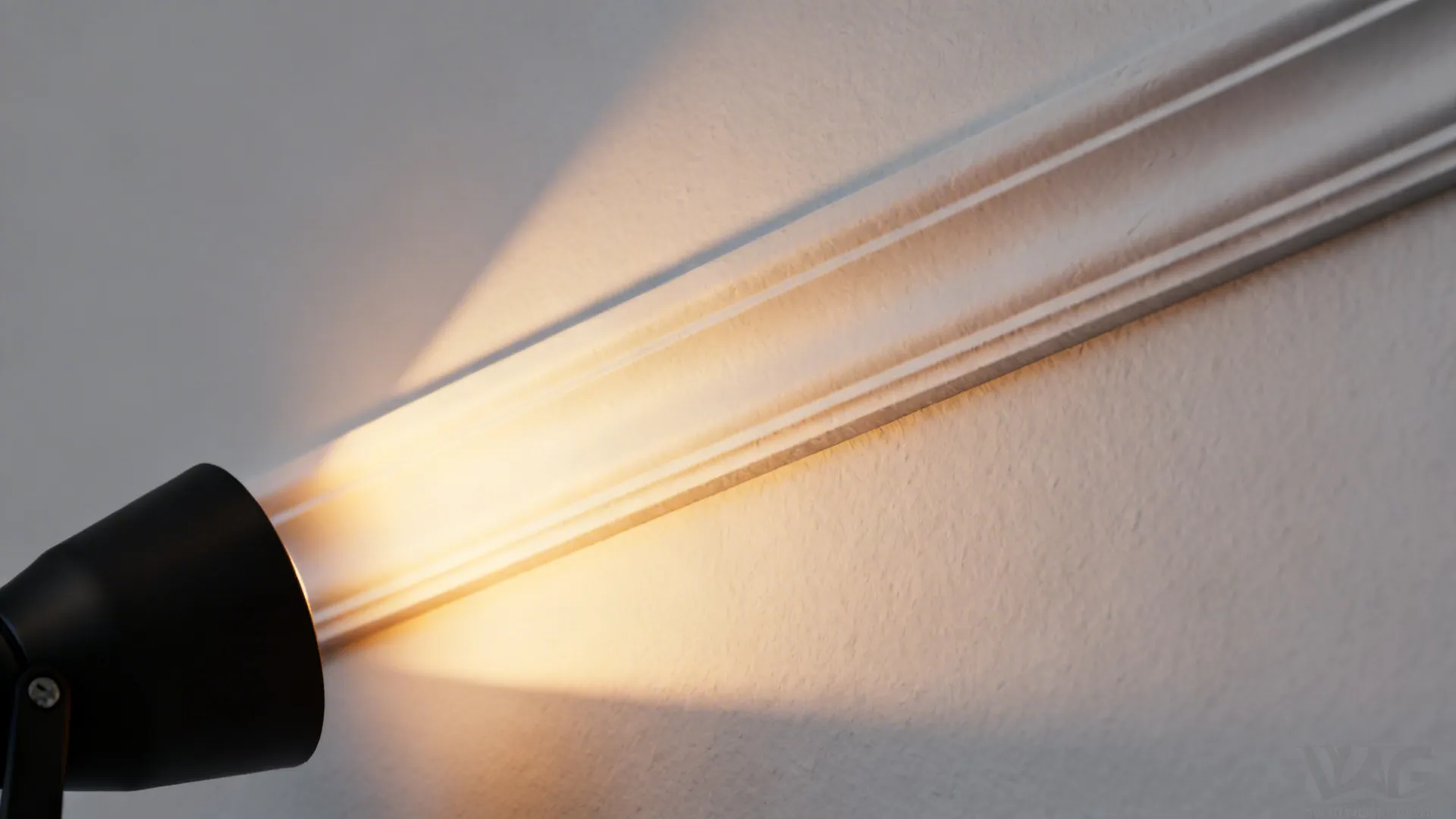 Macro view of a precise knife-edge ceiling slot with asymmetric wall-wash beam.