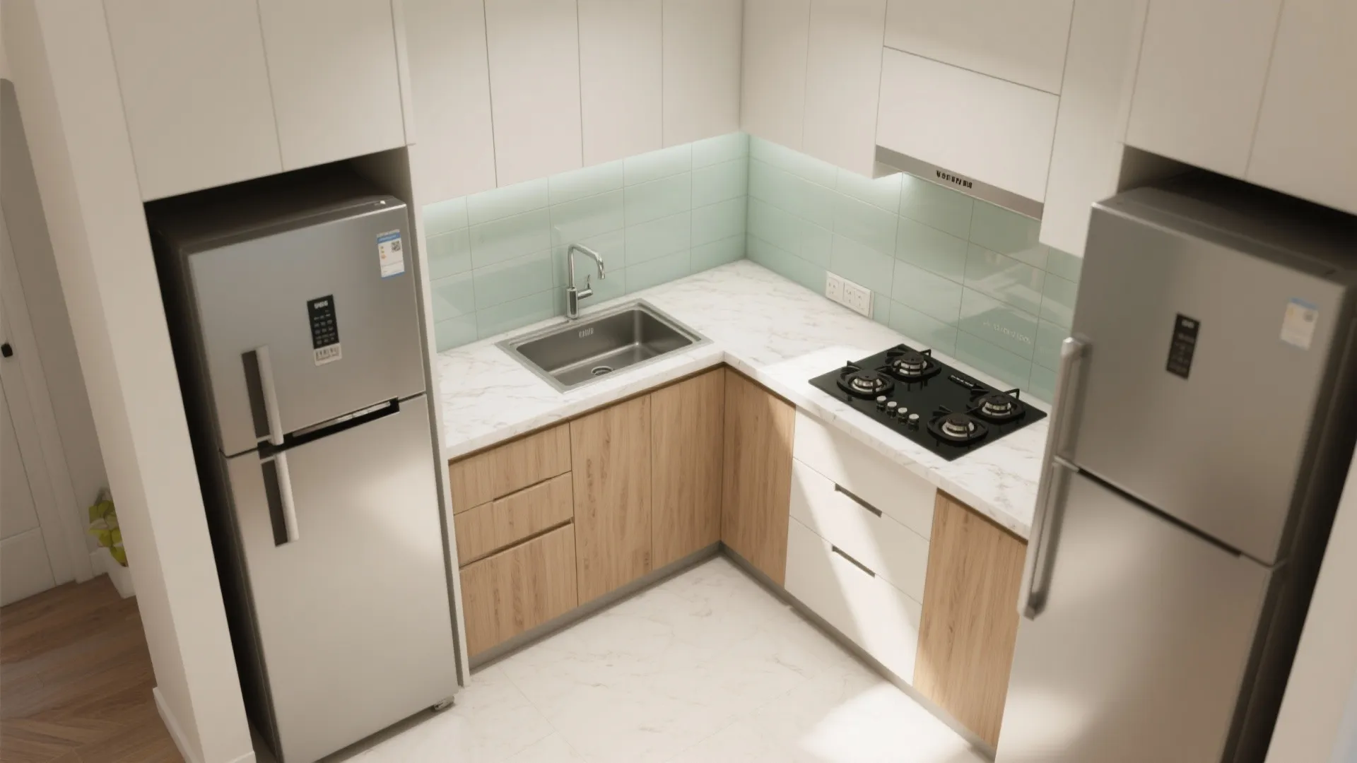 Top view of a small kitchen layout with white marble countertop silver fridge and sink