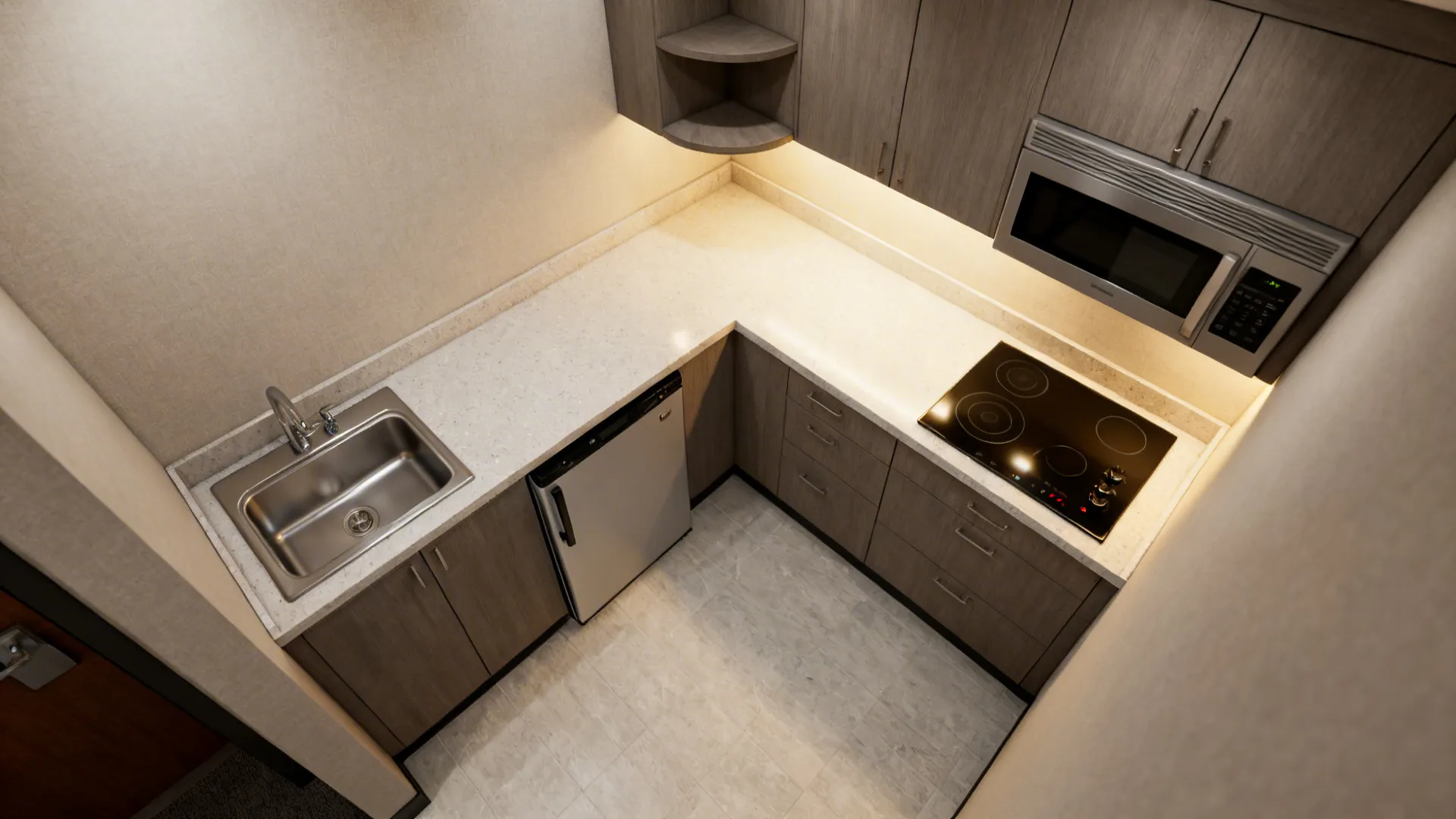 Top-down view of an L-shaped hotel kitchenette with clearances and triangle.