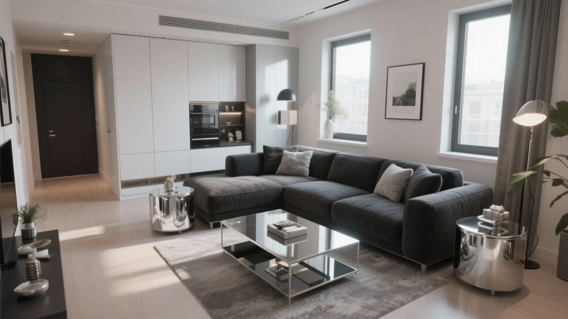 Modern living room with dark grey sofa glass coffee table white cabinets and natural sunlight