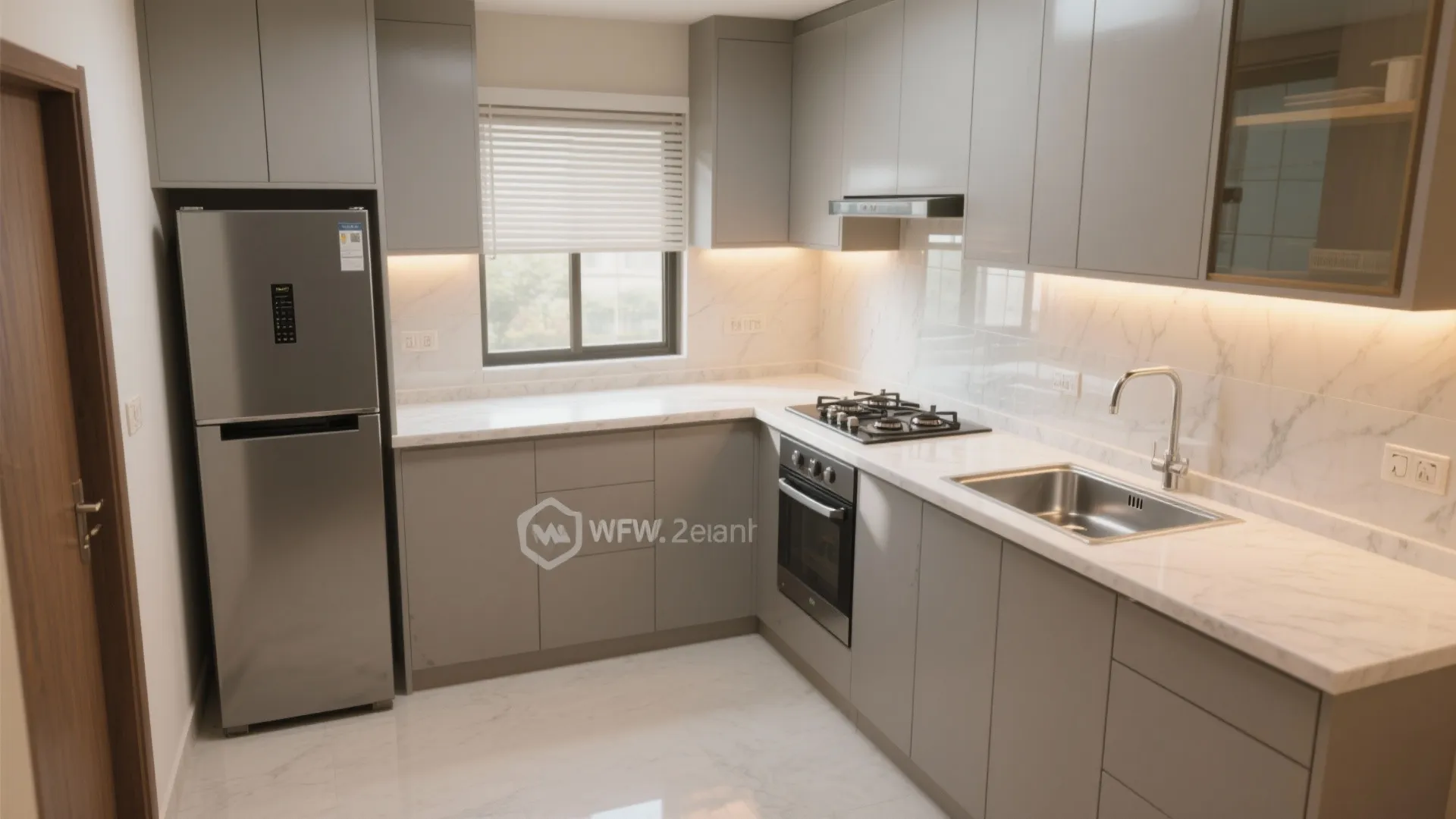 L-shaped compact kitchen with quartz ledge, matte cabinets, and efficient hob-sink-fridge triangle in a 2 BHK.